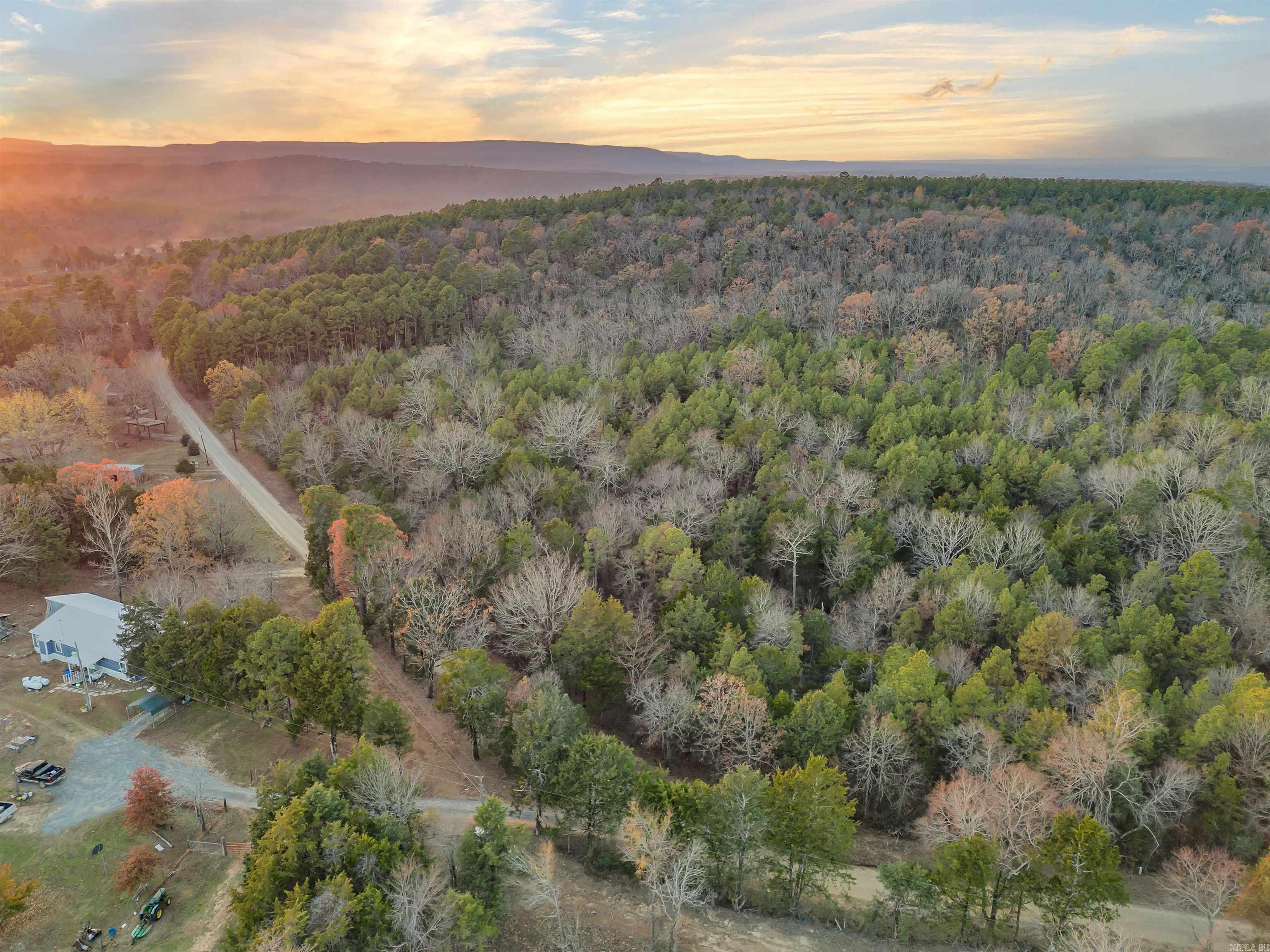 This 14.6-acre parcel of land offers an opportunity for those seeking a serene country lifestyle with county road frontage. Predominantly wooded, the property is ideal for hunting enthusiasts and recreational activities, providing a natural habitat for wildlife and ample space for outdoor adventures. Utilities are readily available at the road, making this an attractive option for potential development or a private retreat.