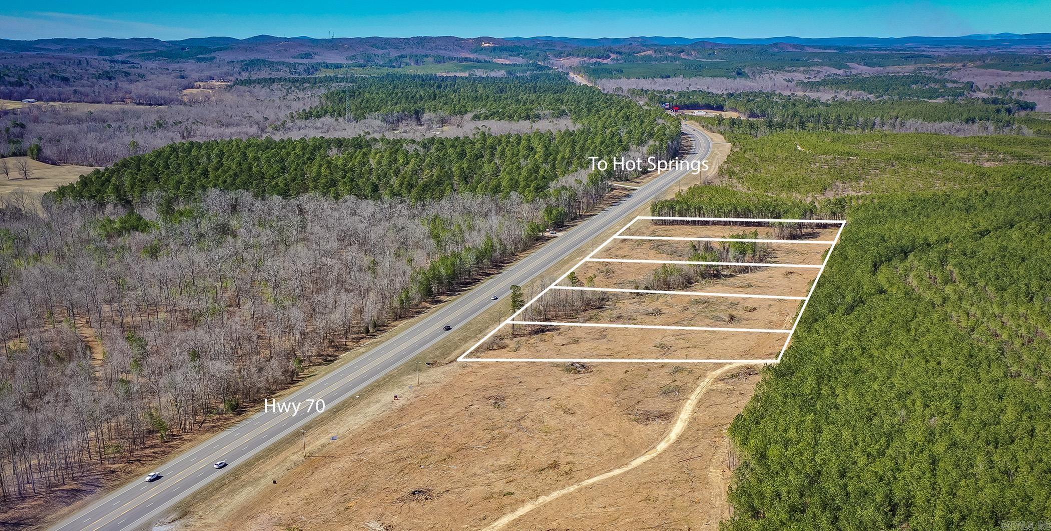 Prime 2-Acre Commercial Lot on Hwy 70E ā Ideal for Convenience Store, Restaurant, Storage Facility, Grocery Store or other commercial enterprise. Located at the Garland/Saline county line in Lonsdale, this lot offers an exceptional opportunity for businesses looking to capitalize on high-traffic visibility and prime location. With easy access to both Garland and Saline counties, the lot provides a strategic position for attracting customers from both areas. The property will have public water and electricity readily available, making it an ideal site for immediate development. Donāt miss your chance to own a prime piece of commercial real estate in a growing area with tremendous potential for high exposure and business success!
