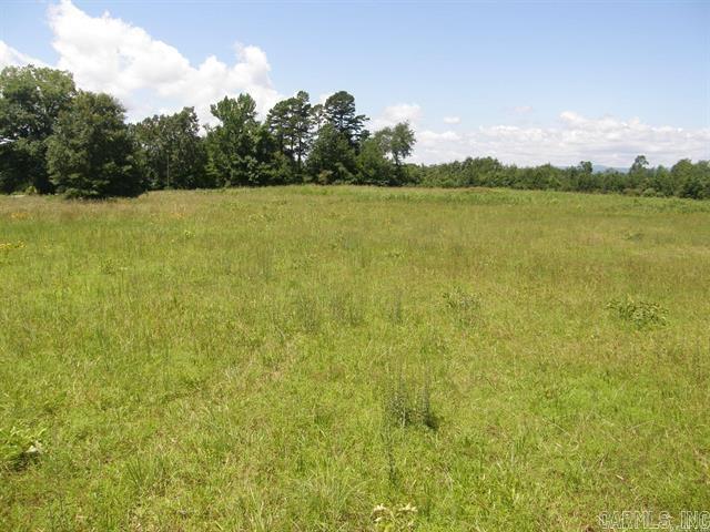 HIGHWAY COMMERCIAL property in Mena, Arkansas with high visibility and many opportunities for potential businesses. Listed as 2 acres - up to 5 acres, more or less, available. 2 turnouts off US Highway 71. Easy access from the highway. Lies between the highway ROW and the railroad ROW. It has city water and electricity.