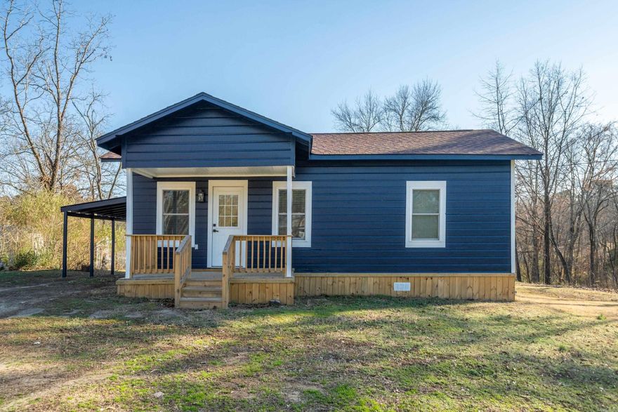 Cute, Cute, Cute! Approximate 125 ft of water frontage Move in Ready, great starter home, weekender, or perfect nightly rental! Completely remodeled from top to bottom, two bedroom, two bathrooms on one acre, has bonus room for office, extra storage, or third bedroom, new wiring, new plumbing, new kitchen with custom cabinets, granite counter tops, and stainless appliances, updated bathrooms, new vinyl plank, new ceiling fans, new roof, new heat/air, new insulation, new windows, new hot water heater, outside patio area, running creek and Lake Hamilton in your backyard! Enjoy kayaking access from your back yard! A must see! Lake Hamilton Schools.