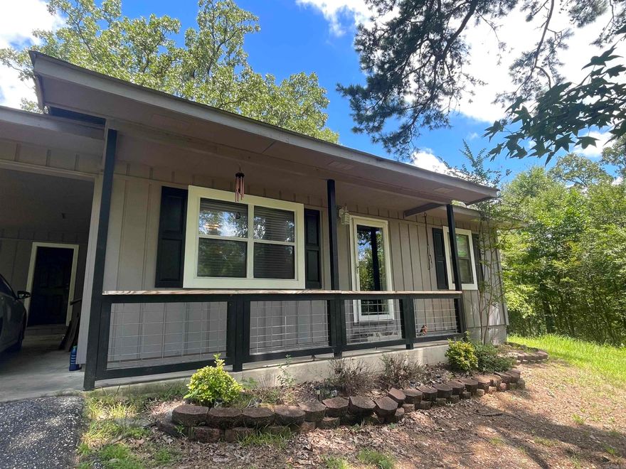 Beautiful bungalow style home, centrally located, and in the Lake Hamilton School District. This home has wonderful water proof flooring, wainscoting, and large laundry room. This home takes advantage of every square foot! Being move in ready this home would be great primary residence or would make an outstanding rental. Appliances are included, as well as an outdoor storage shed with covered awning. Located 4 miles from Hill Wheatly Park and Lake Hamilton boat ramp and 3 miles from Walmart Neighborhood Market.