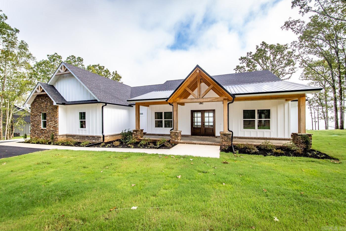 Brand New Home Built with some of the best views on Greers Ferry Lake nestled in the woods on 3 acres! Looks straight over "The Narrows" with panoramic views from Sugarloaf Island to Eden Isle. Attached 2- car garage, convenient Built-ins in the laundry/mud room. Durable LVP flooring throughout the home w/granite countertops, Beautifully tiled master bathroom with large walk in closets, walk in shower & Soaker Tub. Kitchen has hot water option over stove top, built in wine rack & extra cabinet storage under the Breakfast Bar. Covered porches on the front & back of home. Walk in pantry off the kitchen, gas fireplace & all 4 bedrooms & 3.5 bathrooms on the same level. Located only approx. 8.1 miles to Lacey's marina and 2.2 miles to Lakefront Rd. Boat Ramp around the corner. New home, so taxes are TBD.