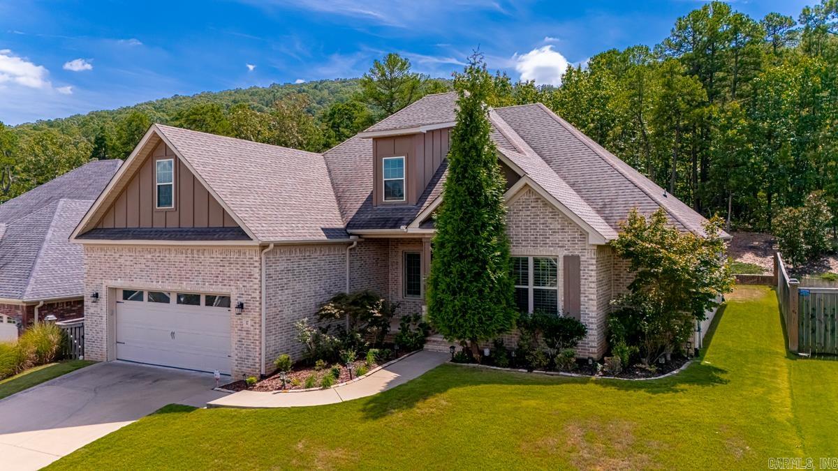 Exquisite all brick home in prime Chenal neighborhood! Beautiful 5BR, 3BA, spacious and bright, open living/dining concept, soaring ceilings. Master suite plus two additional bedrooms and a study/5th bedroom on the main level. Well appointed kitchen with gas cooktop, built-in microwave and refrigerator conveys. Master bathroom features a big walk-in shower, freestanding soaker bathtub and enormous closet. Bonus area, bedroom and a full bathroom upstairs. Laundry room with sink. Ample storage. Outdoor fireplace under large, covered patio overlooking private greenspace.