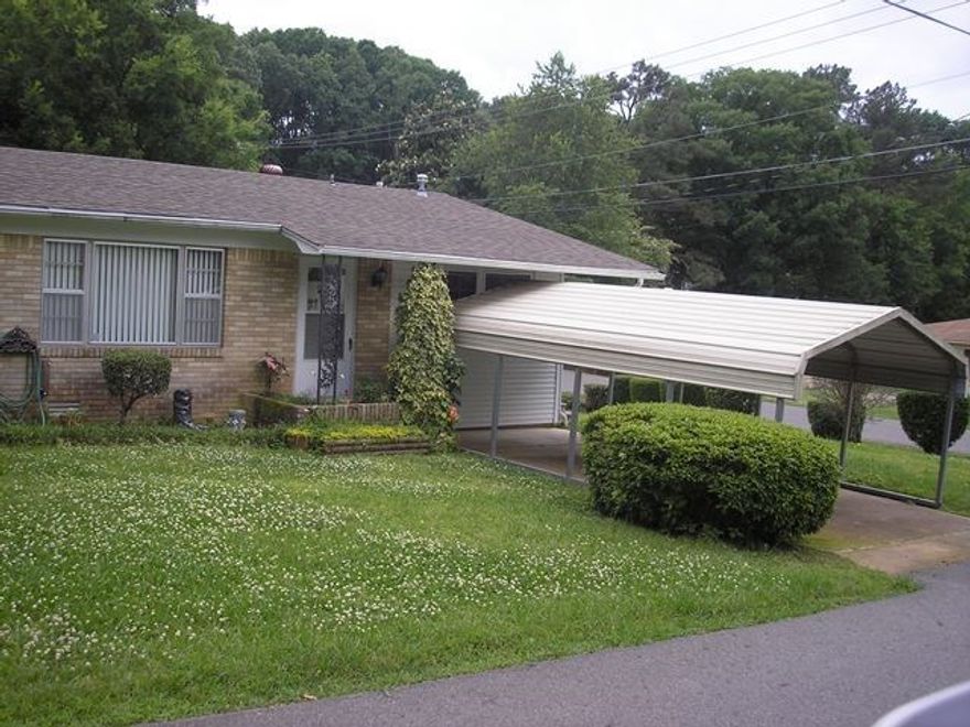 Solid brick home in nice neighborhood, corner lot with fenced backyard, metal carport. Furnace and water heater replaced in 2013. Garden spot and fruit trees. Two storage buildings. Appliances convey with house. Great location - close to shopping and medical care. The laundry room is large enough that it was used as a bedroom by the former owner. Seller will allow $2000 for new carpet.