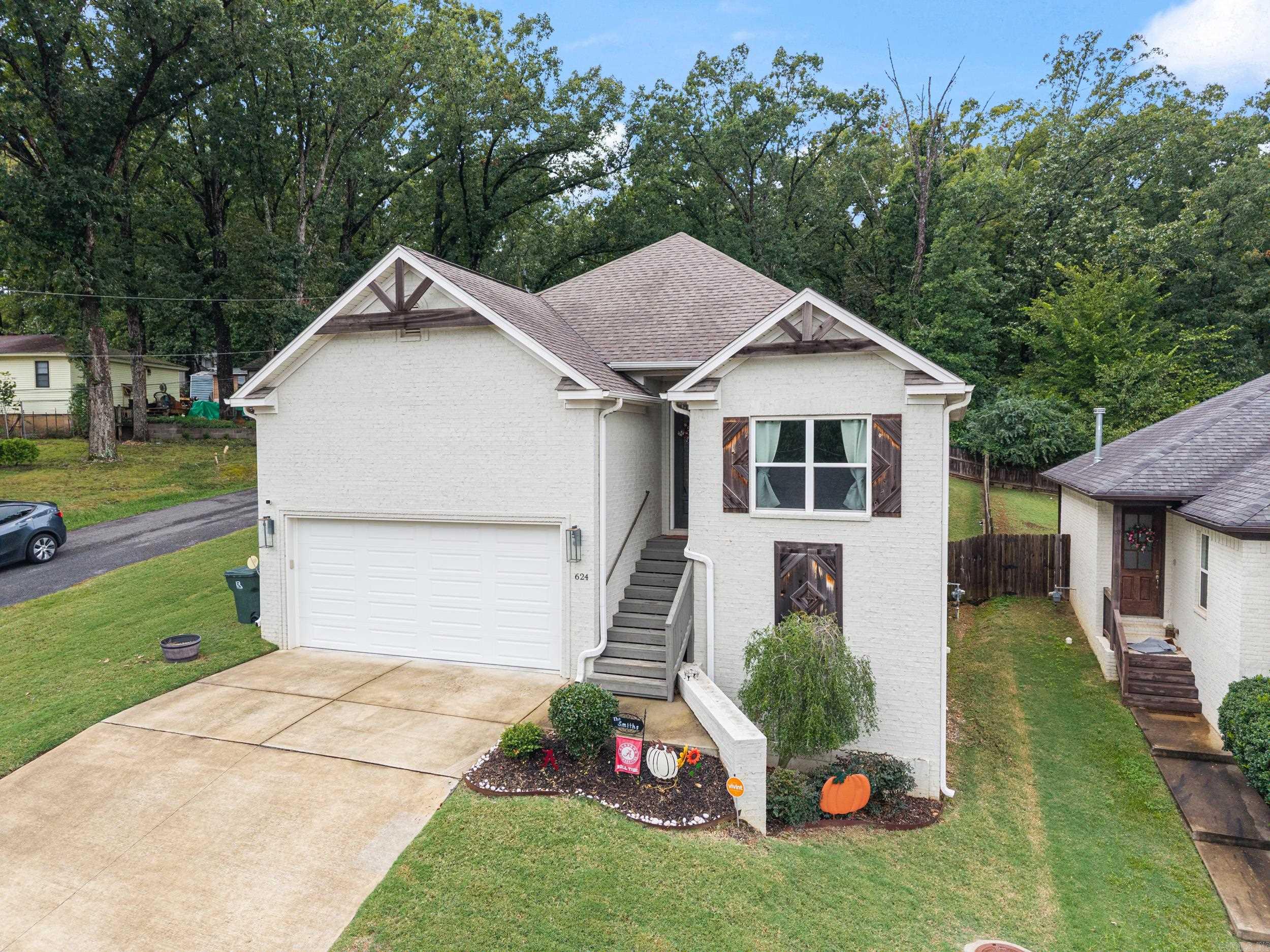 This home offers a perfect balance of modern design and everyday comfort in West Little Rock. 3 bedrooms, 2 bathrooms, and 2 half bathrooms! Built in 2018, it is bright and open with tall ceilings and natural light throughout. The kitchen features a gas range, a pantry, and taller countertops. Built-in ceiling surround sound enhances the living space. A bonus room, laundry room, and pocket doors to the basement add both function and style. Outside, the fully fenced backyard and two-car garage offer ample space. The seller will pay off the solar panels at closing, giving you lasting efficiency and peace of mind. If the Crimson Tide decor makes your Razorback heart skip a beat, here’s your chance—buy the home and make it your own.