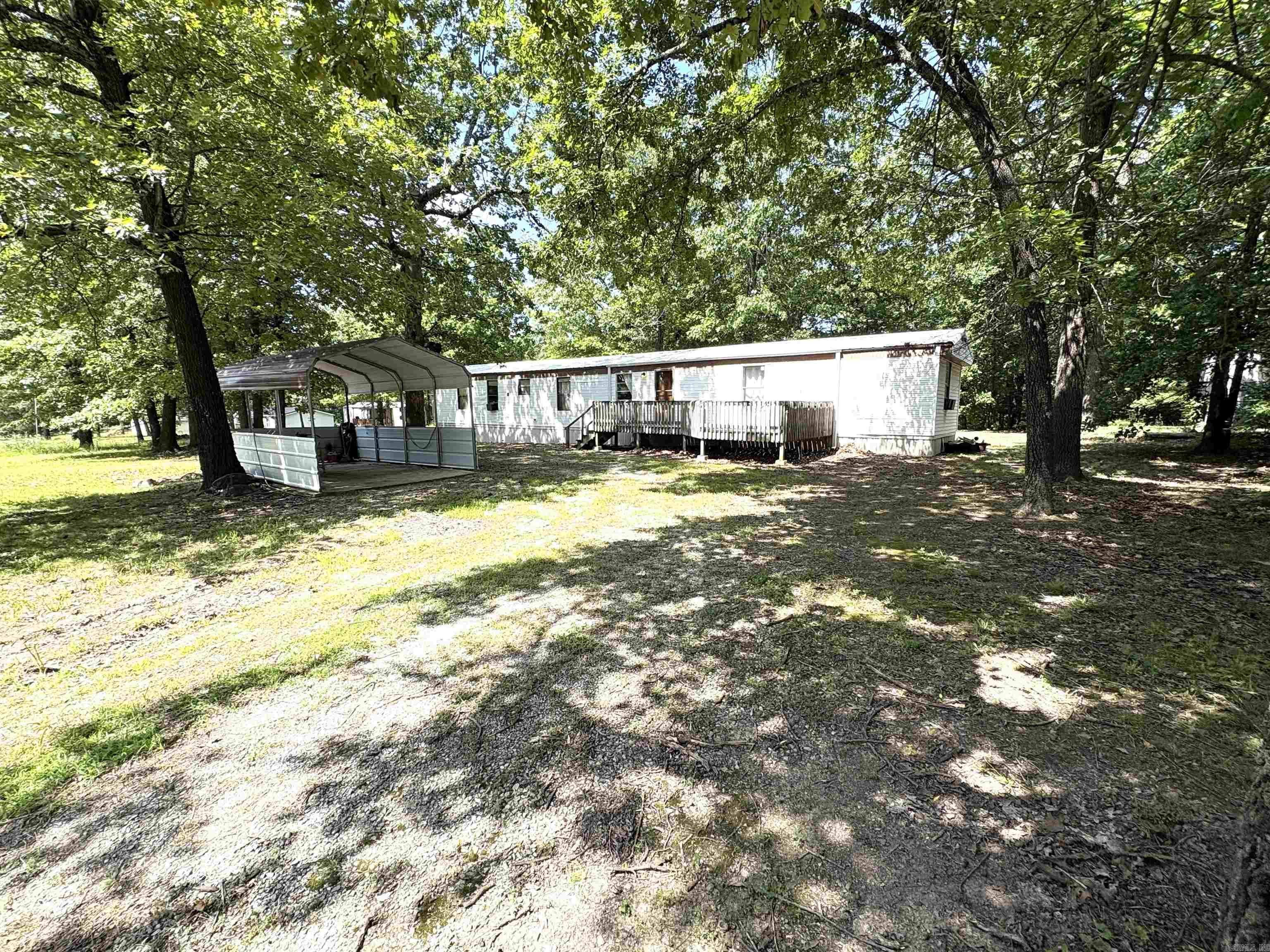 Nice location if your family loves the lake. Regardless if it's boating or fishing. Why rent a hotel room when you could be paying for property you could pass own to your kids. Great price but not to be misleading you will need to invest some money on the inside. A pipe busted under the house two years but those repairs were made. In some areas of the house the subfloor still needs to be replaced. There is plywood covering these areas of the home except between the master bedroom and bath. Please be careful just in case the sellers overlooked any area where floors could be weak. Yes the inside needs a little TLC but someone can come in and polish it up a bit and make it a cozy lake house to enjoy for years to come. Circular driveway allows for lots of parking. The courthouse records show the "effective" age of the house to be 24 years. The property is just .2 mile off HWY 62 East located on a chat covered road . SEE AGENTS COMMENTS
