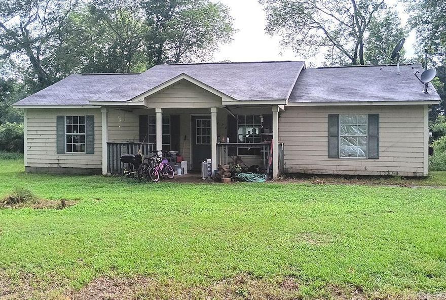 Three Bedroom two bath home on 4 level lots.  Traditional floorplan with a kitchen/dining room combination.  This home has 1300 square feet and is priced to sell.  This home needs some touch up and minor repairs, but it has a lot of potential for the price.    The location is convenient for shopping and dining as well as quick access to Interstate 30.  Please call the listing agent for an appointment. The home is occupied so advance notice is requested.