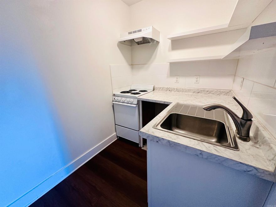 Check out this cozy second floor studio condo!  Full bathroom and kitchen. Heated and cooled via PTAC  12 month lease. No pets $750/month, includes electricity, water and trash. $500 Security Deposit $50 Application Fee $500 security deposit