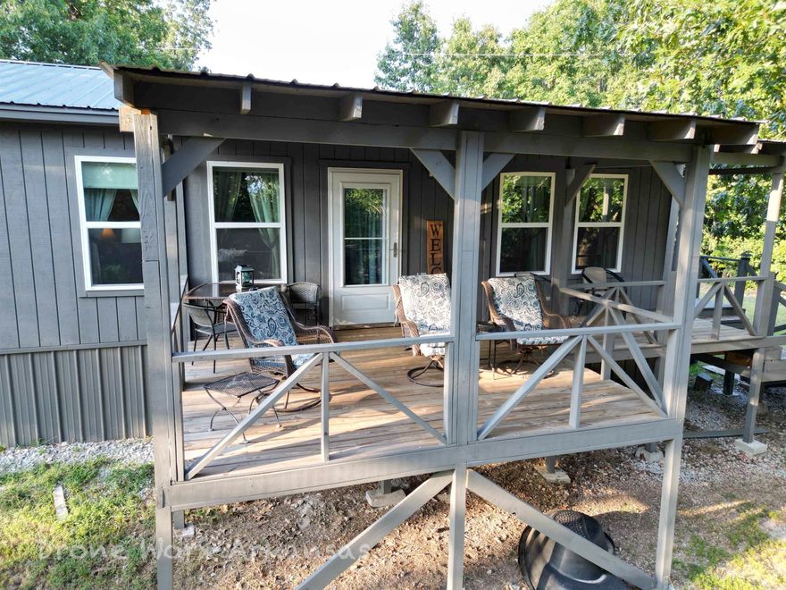 Handicap accessible! This recently built 2 bed, 1 bath home is down a long county maintained road where the noise of life is way off in the distance.  Find your peace and let your mind relax at this retreat.  Rural water, electric, and with a few trees cleared out off the back porch, this home has the view.  Not too far from the famous Buffalo National River, you can access the water in the summer, trek off to Harrison, just a short drive north, or keep on exploring all the way to Branson, Missouri.  Mostly wooded, this property has minimal maintenance. There are sheds and storage building for your equipment, toys, or whatever you need to keep sheltered.  There is access directly off Cane Branch Road once a few trees are cleared out.  Be prepared to feel right at home once you enter the front door.  Whether it's a cup of coffee or a glass of wine, the back porch will not disappoint.