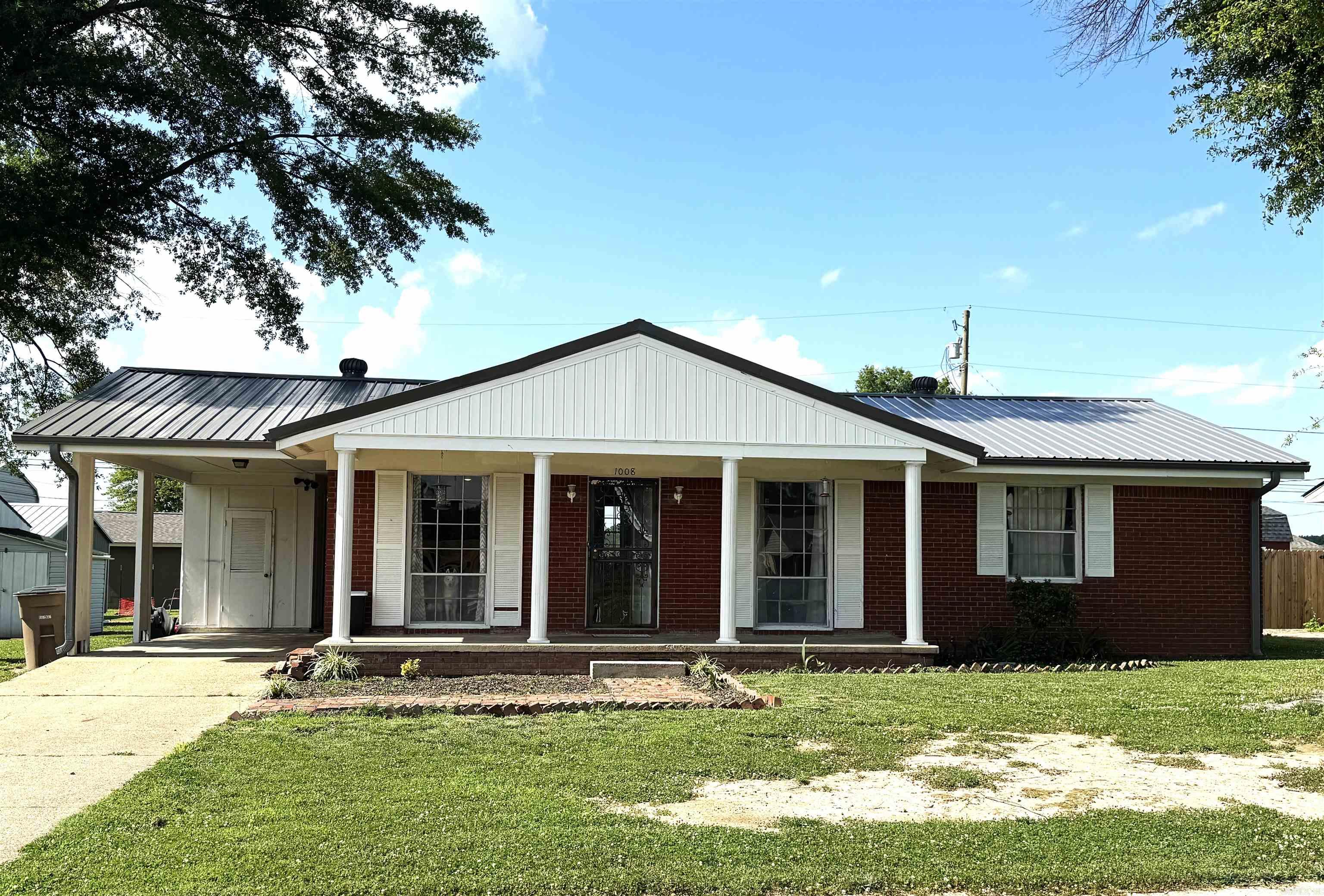 Located close to the schools, football field, churches, and shopping, this new listing is perfect for a first time home buyer! The metal roof was replaced in 2024 and the HVAC is approximately 2 1/2 years old. The lot is flat and has a great back yard for kids or grilling. The interior was painted about 4 years ago and vanities were replaced in both bath rooms. The spacious family room is open to a dining area and all bedrooms are a nice size. The stove remains in the kitchen and the refrigerator and washer and dryer are negotiable. Call today and you can be living in your new home when school starts!!
