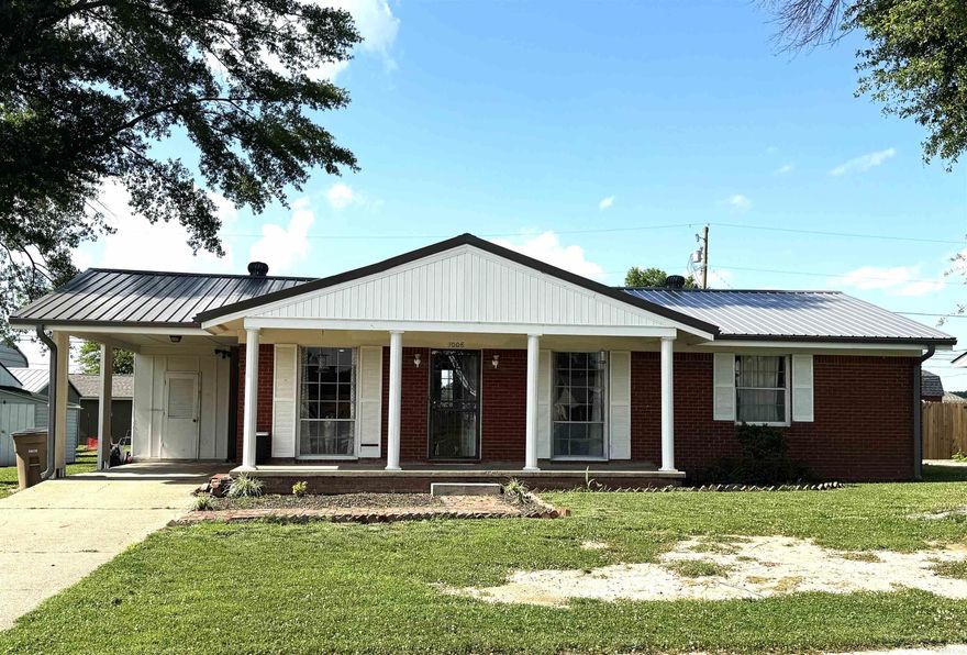 Price Reduced!!! Located close to the schools, football field, churches, and shopping, this new listing is perfect for a first time home buyer!  The metal roof was replaced in 2024 and the HVAC is approximately 2 1/2 years old.  The lot is flat and has a great back yard for kids or grilling.  The interior was painted about 4 years ago and vanities were replaced in both bath rooms.  The spacious family room is open to a dining area and all bedrooms are a nice size.  The stove remains in the kitchen and the refrigerator and washer and dryer are negotiable.  Call today and you can be living in your new home when school starts!!