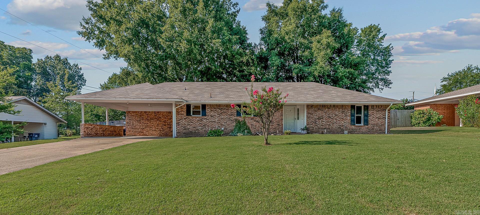 Ranch style, 1 level home on .42 acres with 3 bedroom, 2 bathrooms and beautiful hardwood flooring! NEW PAINT throughout in a light, creamy white. From the front door entry, you'll see a large & vaulted living room & a lovely open kitchen tucked perfectly just around the corner! The master ensuite has walk-in shower. There's an extra large laundry room, beautiful NEW DECK off the spacious SUNROOM, a tankless gas hot water heater, NEW ROOF, fully FENCED backyard with a large WORKSHOP with overhead door, a 2nd large SHED for more storage, concrete pad - can be used for basketball, or extra parking area! So much to see and in a GREAT LOCATION! Backyard is private, and beautiful with mature trees! The sunroom overlooks the backyard ~ so inside or outside you'll enjoy the beautiful & peaceful views!