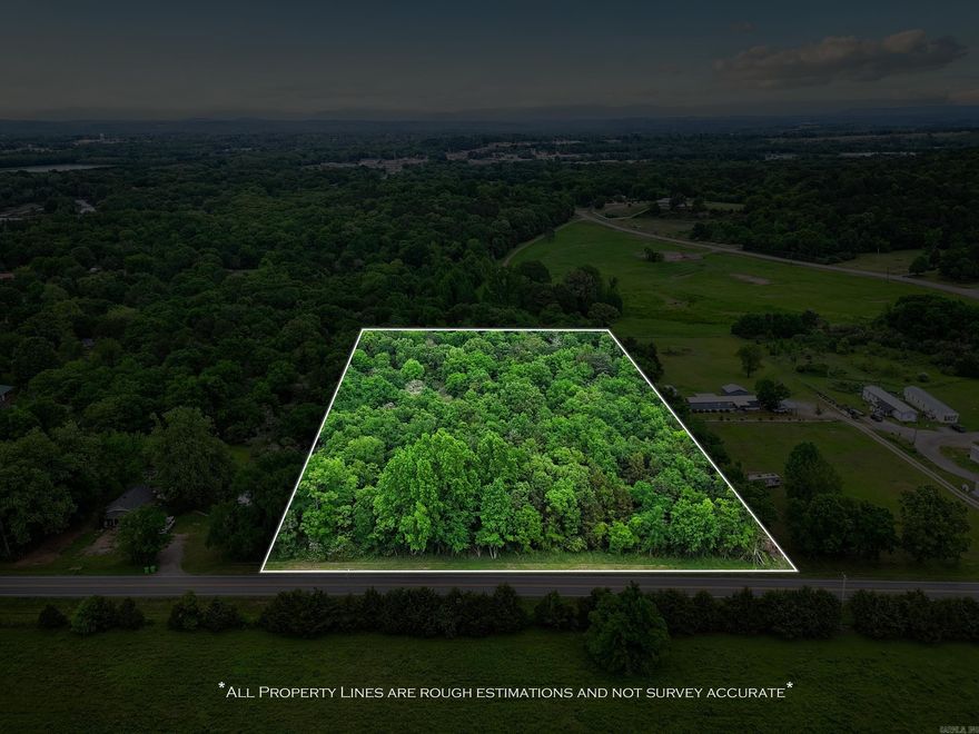 Rare 4.5-acre wooded tract inside Clarksville city limits. Private, rolling terrain with mature hardwoods, ideal for a secluded custom home site, multi-home opportunity, or recreational retreat while remaining close to city amenities and schools. Property is close to Spadra park and Arkansas River. Easy access from a paved road; bring your builder.