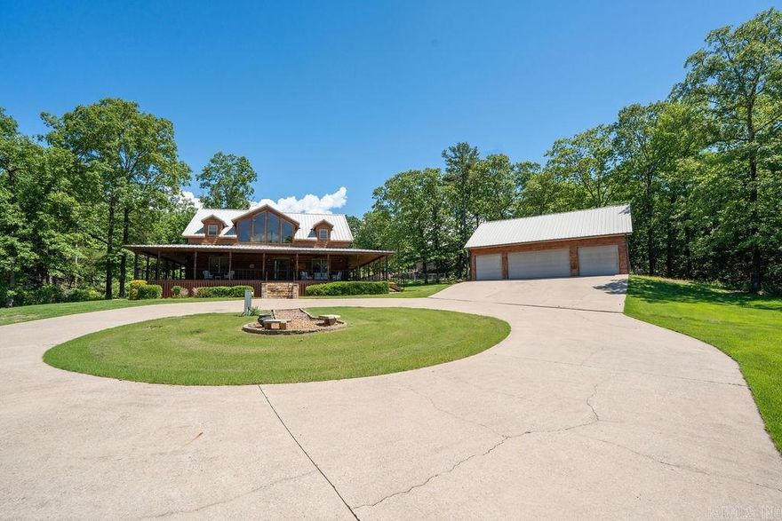 Escape to your own retreat on 5 acres just outside of town! This stunning log cabin features a paved driveway, a wet weather creek, an above-ground pool, and a fenced yard for peaceful days by the water. Unwind on the wrap-around porch or fire up the grill in the cozy covered grilling nook. A 4-car detached garage with partially finished living space above adds even more charm. The 30x40 shop with soaring 14' ceilings is heated/cooled and perfect for all your hobbies. Inside, enjoy 3 spacious bedrooms with walk-in closets, updated bathrooms, and a beautifully refreshed kitchen.  A separate drive leads to the shop with plenty of space for all your projects. Just 2 miles from Cow Shoals for world-class fly fishing and 6 minutes to downtown Heber Springs!
