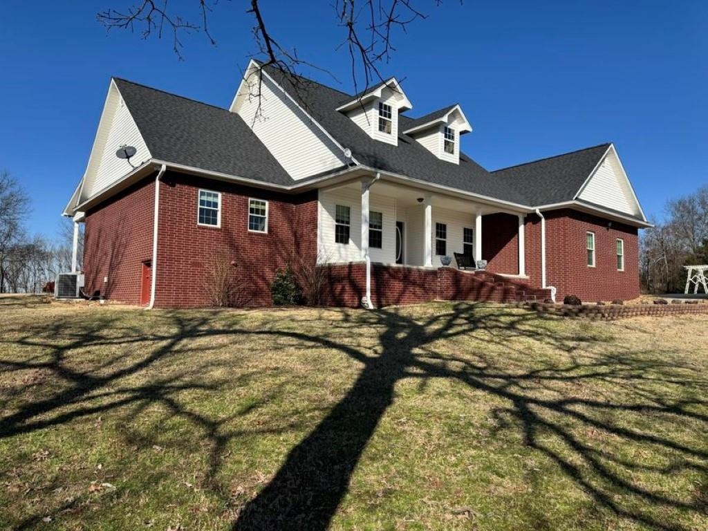 Don't miss this once-in-a-lifetime opportunity! This one-owner custom home, situated on 20 acres, is seeking a buyer who will appreciate its long porches, beautiful views, and privacyāwhile still being close to town. Spanning 2,800 square feet, this home offers a spacious layout where your family can enjoy their own bedroom and bathroom suites, complete with oak closet organizers. The wide-open living room features a charming stone fireplace, and there's an upstairs bonus room perfect for workouts, sleepovers, or a potential fourth bedroom. The kitchen boasts handcrafted maple cabinets with pull-out drawers, an in-counter range, and a unique see-through refrigerator. Scheduling showing appointments is easy, but they must be accompanied by an agent. Call today for your personal tour!