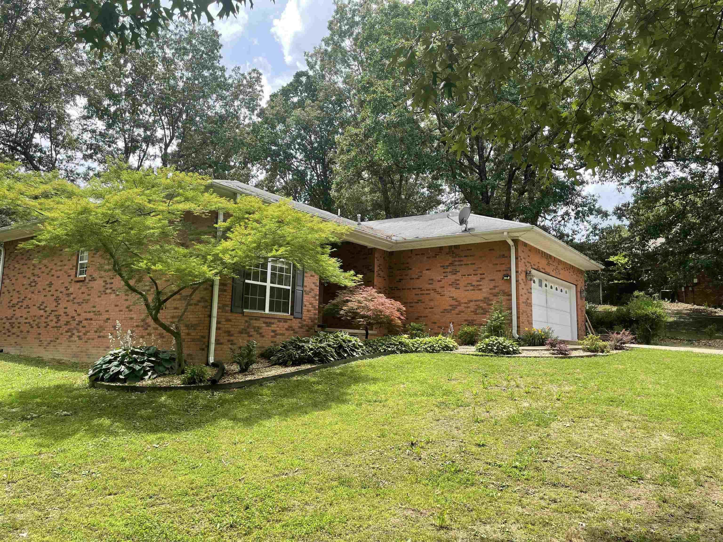 Take a look at this beautiful 3 bedroom 2 1/2 bath home. This home is located in a highly desirable neighborhood in Pocahontas and boasts 1754+\- square feet of living space. This split level plan features a large kitchen with breakfast area, a formal dining room and large living area on the ground floor. Ceramic tile floors run through the kitchen with the dining and living area being luxury vinyl plank. The upper level houses all 3 bedrooms and 2 1/2 baths. Your guest bedrooms feature a Jack and Jill bathroom with tile floors. Both bedrooms have been updated with new LVP flooring. The master bedroom features an on suite bath with walk in tile shower and a generously sized walk in closet. The spacious back yard and deck are is accessible through the breakfast area, perfect for grilling and entertaining, and is fenced for pets and children play area. A detached 16x20 garage has been converted to extra living space, great for overflow guest or a private work shop. The home also includes an attached 2 car garage and beautiful mature landscaping to add to curb appeal.