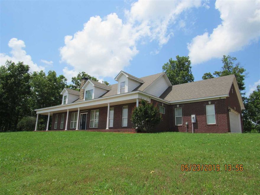 Well maintained two story home with a great view! Combination of stained concrete floors & carpet, main level master suite with 2 additional bedrooms, all kitchen appliances including refrigerator, washer & dryer hook-ups, side entry 2 car garage. Upstairs boasts of the 4th bedroom, 3rd bath, office, and two large bonus areas, oversized deck, semi-wraparound covered porch, storm shelter, and more!