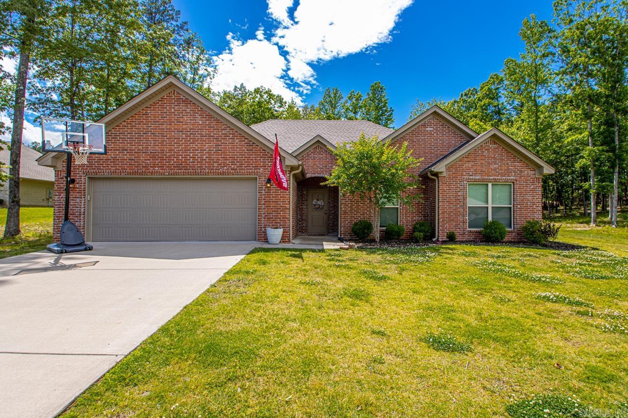 **FASTASTIC HOME PRICED WELL BELOW MARKET VALUE** Country Living on almost an acre conveniently located to Benton, Bryant & WLR! This like new home has been meticulously cared for and well loved! Featuring a large entry area that leads directly into the open concept Living/Kitchen/Dining spaces! With raised ceilings, a beautiful fireplace and so much space to offer, this setup is perfect for large families, cozy nights and lots of entertaining! The living area boasts beautiful hard wood floors and neutral colors for ease of decorating! The hardwoods run throughout all the main areas, including the kitchen, hallways and 2 guest bedrooms. Tile in all other wet areas. The only carpet in the home is in the Master bedroom/closet! Speaking of the master closet, it is huge! All bedrooms are oversized and have amazing closet spaces! The garage is oversized with plenty of space for 2 vehicles AND lots of storage!! All of this AND sitting on a large, flat tree surrounded yard! There is so much here to see but you better hurry, this one is too good to wait! Contact me or your agent today and schedule your private showing!