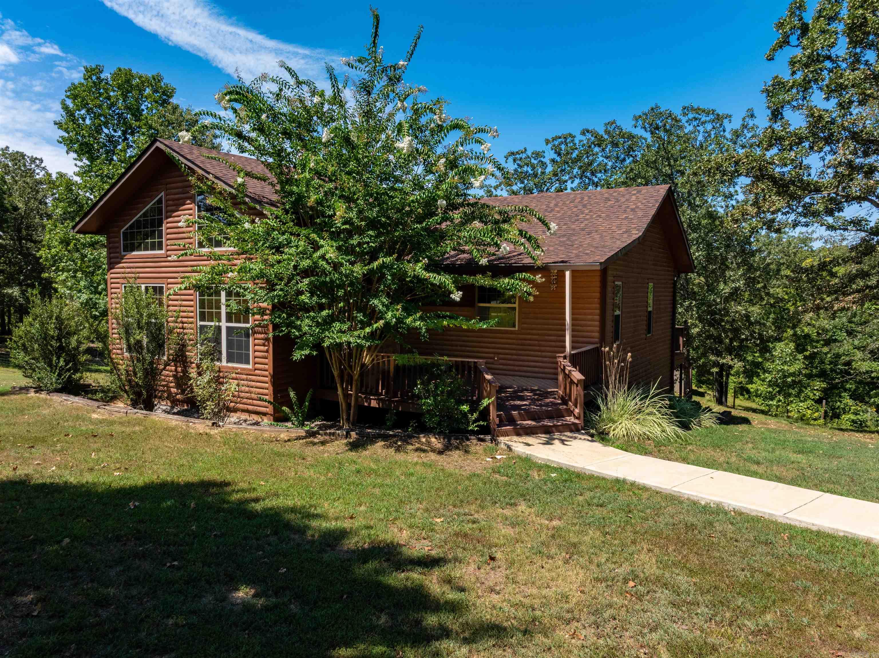 Country Home with Shop, Barn, and 8± Acres ā Near Black Rock & the Black River Charming 3-bed, 2-bath cabin-style home on 8± acres just outside Black Rock, AR. Built in 2012, this owner-built, one-owner home features vaulted ceilings, an open floor plan, knotty alder kitchen cabinets, and a loft overlooking the living room. Primary suite has private bath & laundry; French doors lead to a full-length back deck. Updates include a new roof & deck. Property includes a 30x40 insulated shop with mini-split, bathroom, sink, cabinets, roll-up door, and 3-car carportāperfect for hobbies, storage, or entertaining. A 30x30 barn with stalls, tack room, and 20-ft awning is livestock-ready, with both shop & barn on water and electric. 8± acres fenced with woven wire, ideal for goats, horses, or cattle. Private dead-end drive with only ½ mile of gravel, yet just minutes to town. Bonus for Duck Hunters: Out of the flood zone and minutes from the Black River, this property sits between the Dave Donaldson WMA and Rainey Break WMA, two of the largest waterfowl refuges in northern Arkansas, and only 30 minutes to Harold E. Alexander WMA for excellent turkey & deer hunting. This is a MUST SEE