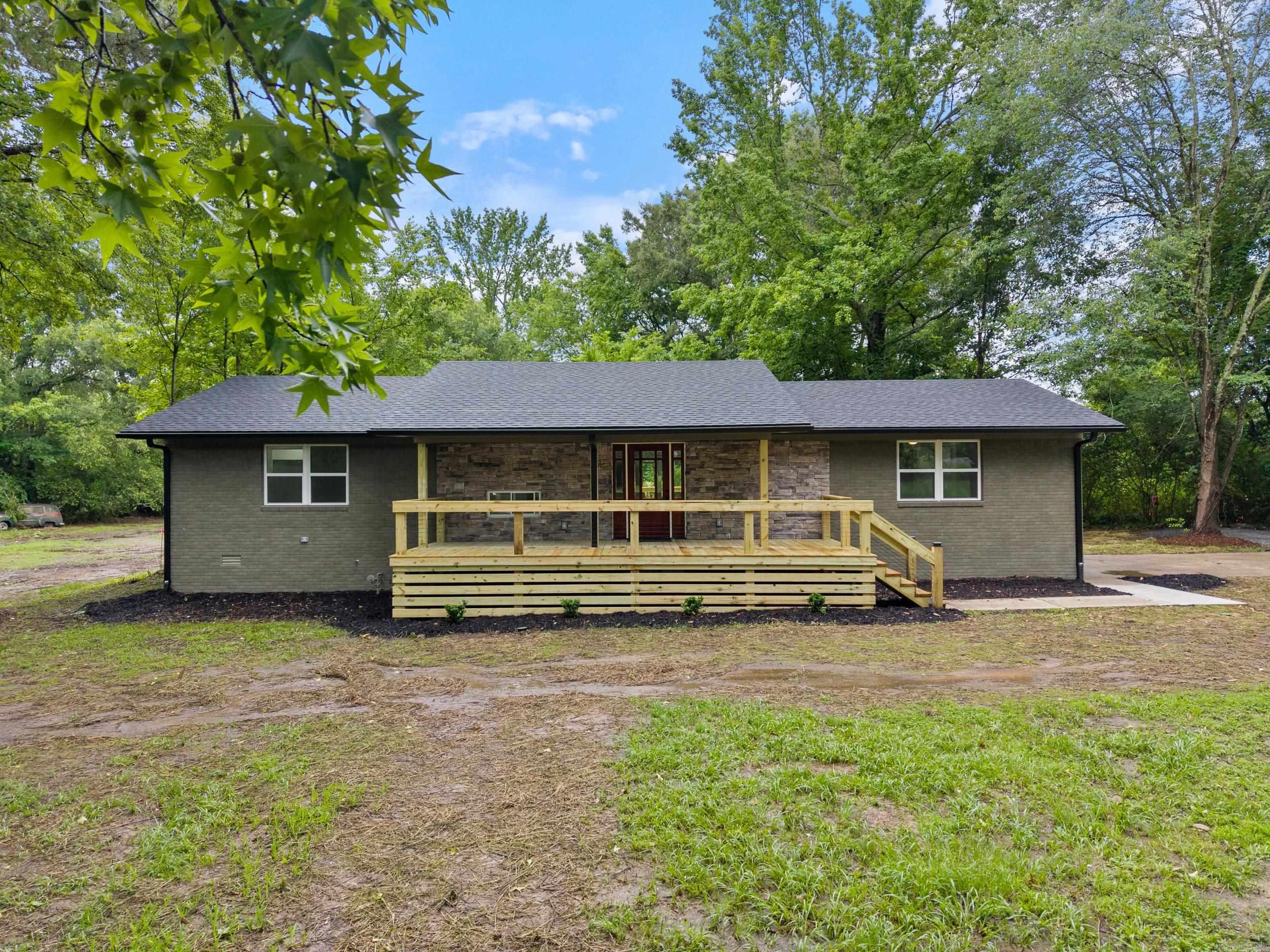 Absolutely stunning remodeled home on 1.37 acres in Wooster. Luxury vinyl floors throughout with an open floor plan that has plenty of space for family and guests. The beautiful kitchen with granite countertops and custom backsplash also features a large walk-in pantry. The primary ensuite is separate from the other bedrooms. Primary bathroom boasts two sinks and custom tile shower. Walk-in closet. Two other guest bedrooms on the main level. There's also a second storage area on the first floor with cubby for even more storage. Downstairs you'll find the 4th bedroom, which could also be used as a bonus/media room or office. As great as the remodeled interior is, the outside is just as enticing. Two large all new wood decks, one on the front one out back, make this home perfect for outdoor entertaining. There's also a koi pond with bridge and fountain in the park-like back yard that leads to a fire pit area. This is a great location. Inside Wooster city limits, but has a country feel. Only 4 minutes to Dollar General and Wooster Elementary. 6 minutes to Greenbrier High School. 10 minutes to I-40. 15 minutes to downtown Conway.
