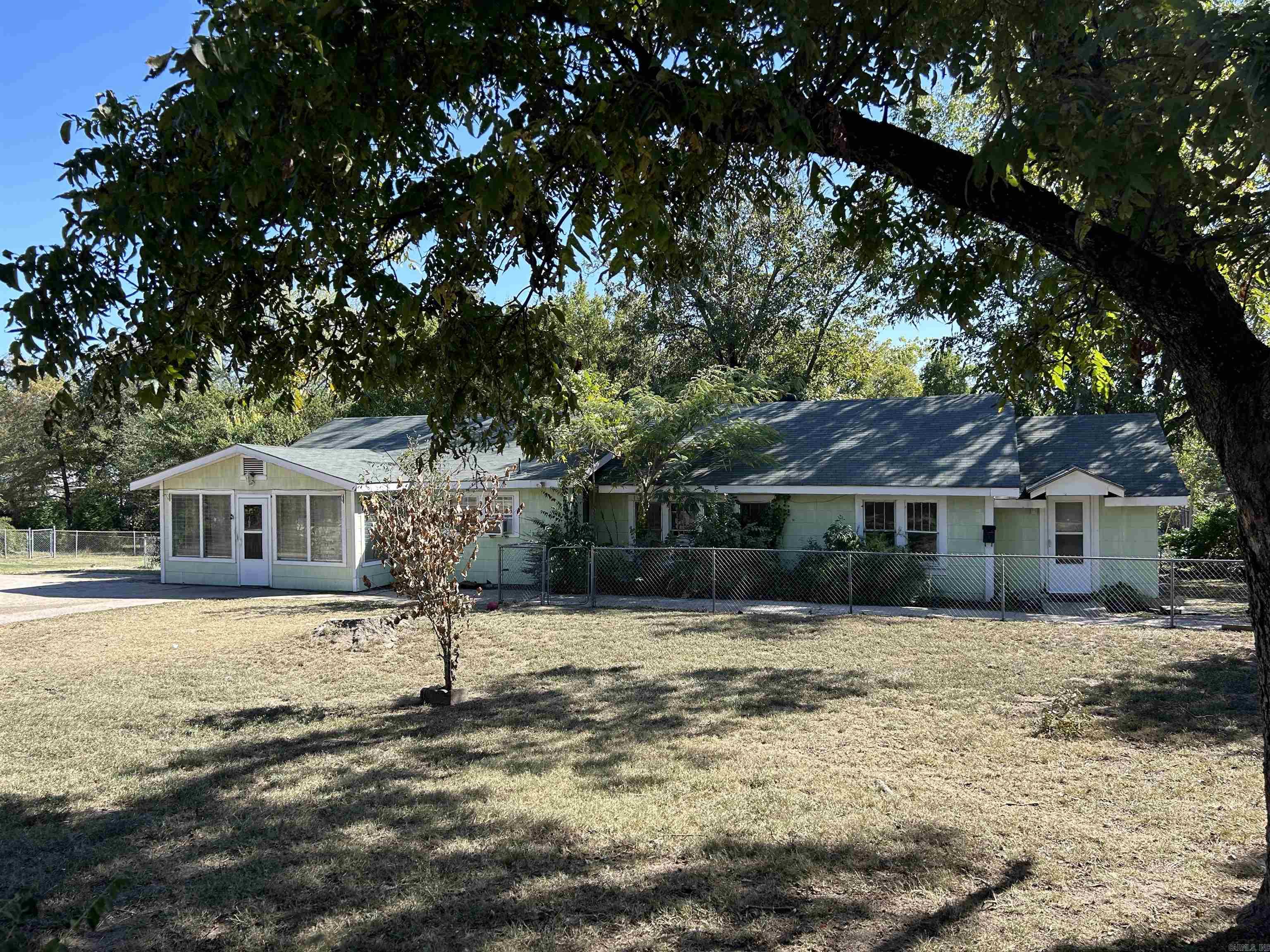 This multifamily property offers instant income with 2 fully occupied units. The duplex offers a combined total of 2688 sq ft with 8 bedrooms and 4 bathrooms, making it an ideal setting for substantial rental income. Located in the heart of Hot Springs and within walking distance to Oaklawn Racing & Casino. Currently, one-year leases secure a monthly income of $3,100. The duplex sits on a spacious corner lot and comes with an additional fenced lot, offering ample space for parking and outdoor entertainment. Both units are in good repair with a newer roof and offer new floors, updated kitchens and bathrooms, updated electrical, and efficient new window air conditioning units and new gas wall heaters. The larger unit features 5 bedrooms and 2 bathrooms, while the cozier unit offers 3 bedrooms and 2 bathrooms. Please note, showings are by appointment only and must be scheduled at least 24 hours in advance. Please respect the privacy of the current residents by not visiting the property unannounced. If you're looking to expand your investment portfolio or step into the landlord game, this duplex promises a blend of steady income and growth potential. Contact agent for more information.