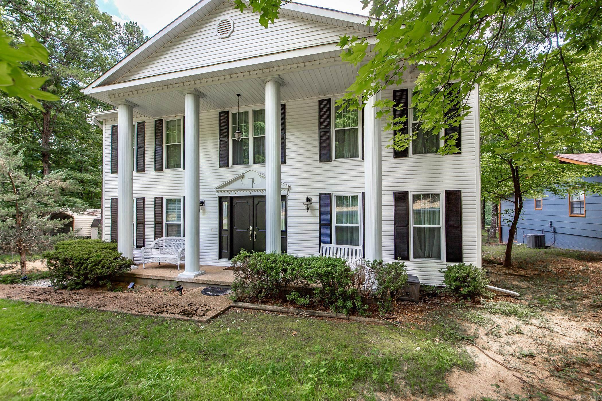 Step into a world of elegance & comfort with this remarkable Colonial-style home, located directly on the picturesque fairway of Indian Hills Golf Course, overlooking Fairway #3. Ideal for golf lovers & outdoor enthusiasts alike, this residence offers a unique lifestyle in the heart of Fairfield Bay. For those who enjoy lake activities, a convenient boat launch is just 2.8 miles away, providing effortless access to Greers Ferry Lake for all your boating & water sports adventures. Fairfield Bay is an outdoor resort destination, offering a wealth of activities such as ATV/UTV trails, hiking/biking trails. The community features two exceptional golf courses, pickleball, and tennis courts, and a full-service marina. Inside, the home boasts beautiful hand-scraped hardwood flooring that brings warmth & sophistication. The large master spa bathroom provides a luxurious retreat, & the private sunroom off the master bedroom is perfect for peaceful mornings or relaxing evenings. There is also a sunroom on the main level of the home. The kitchen is equipped with everything needed to entertain family & friends including a large butlerās pantry. There is an outdoor storage & carport for toys.