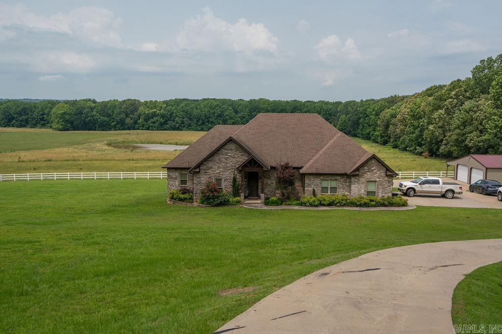 4 Bedroom/2.5Bath/2Acres/30x40 ft Shop Gorgeous split plan home with 9' ceilings, custom cabinets, solid surface counters and a cozy gas log fireplace. Primary suite features his and her closets, soaking tub and separate shower. Enjoy a covered porch with outdoor kitchen + STUNNING VIEWS!!! Huge 30x40 shop with 2 roll up doors. Don't miss this rare find!!!!