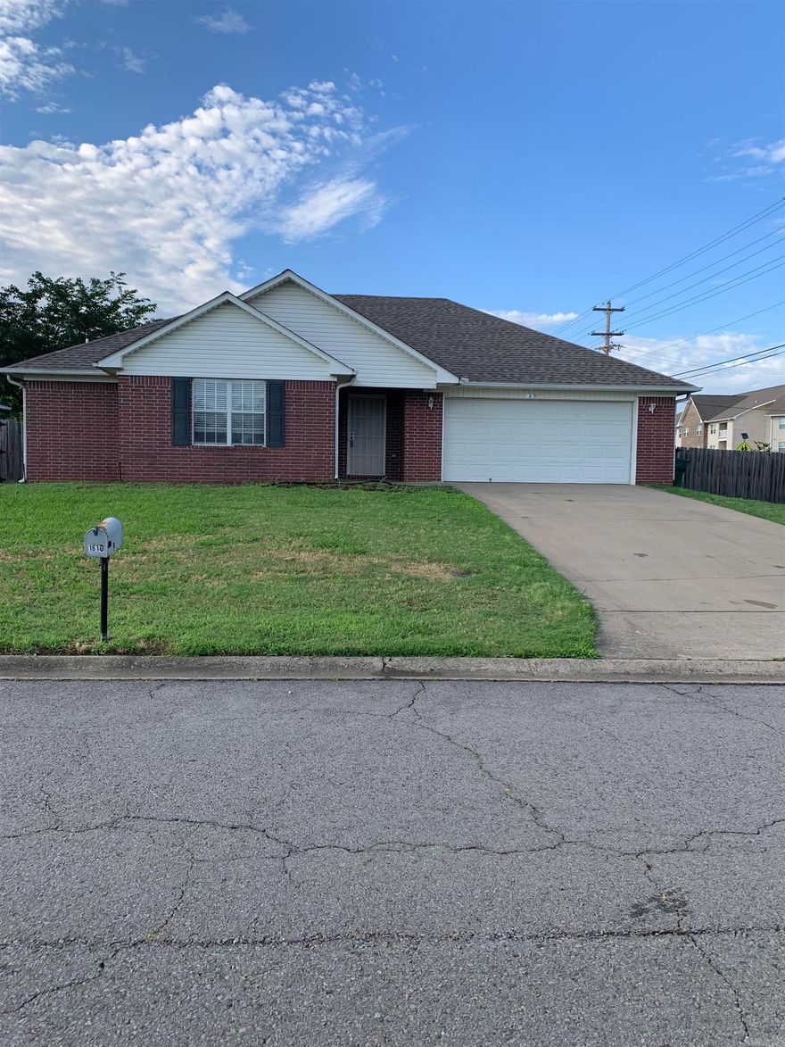 Coded LBX Code is 6350. Vacant, show anytime. Fresh wall paint, cleaned carpet, lawn trimmed up, house was professionally cleaned. 3BR, 2B, 2 car garage, 2" blinds on windows, big laundry room, refrigerator stays.  Corner lot. Covered back porch, big fenced back yard. Kids can walk across the street to Simon Middle School. Harp's Grocery & gas station, Domino Pizza, & Sonic is just up the street. New roof 11-2023. Sold "as is" and seller will provide home warranty. Seller cannot finance. Seller will look at any & all offers.