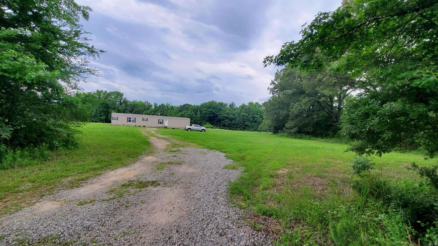 Country living is the best. This Cutie is right outside Beebe with an El Paso Address. Come see this Nice 3 Bedroom 2 bath Vinyl Siding/Shingle Roof Single Wide MH on 3 acres, sitting in at an angle with tree line wrapping on 3 sides for privacy. Great for first time buyers or if your looking for a beautiful piece of Property to build on... this would be great to have a place to live while building. (Plenty of room in front or behind the home to build.) Nice Size Living Room open to Dinning and Kitchen, Bar has faux rock work and dining has wrap around cabinets with same rock look backsplash for a unique rustic feel with lots of Storage. Kitchen is Beautiful with a Wood Vent-a-hood and farm style sink. You will love the Master Bath complete with Deep Soaker Tub, Double Sink/vanity Linen cabinet then separate toilet room with a walk in shower. Large Master Closet. This home is Block/level and tied down to Hud Specifications but is not on a permanent  foundation. Also has Vinyl Skirting so this will not pass for VA or FHA Financing. See agent remarks for showing instructions.