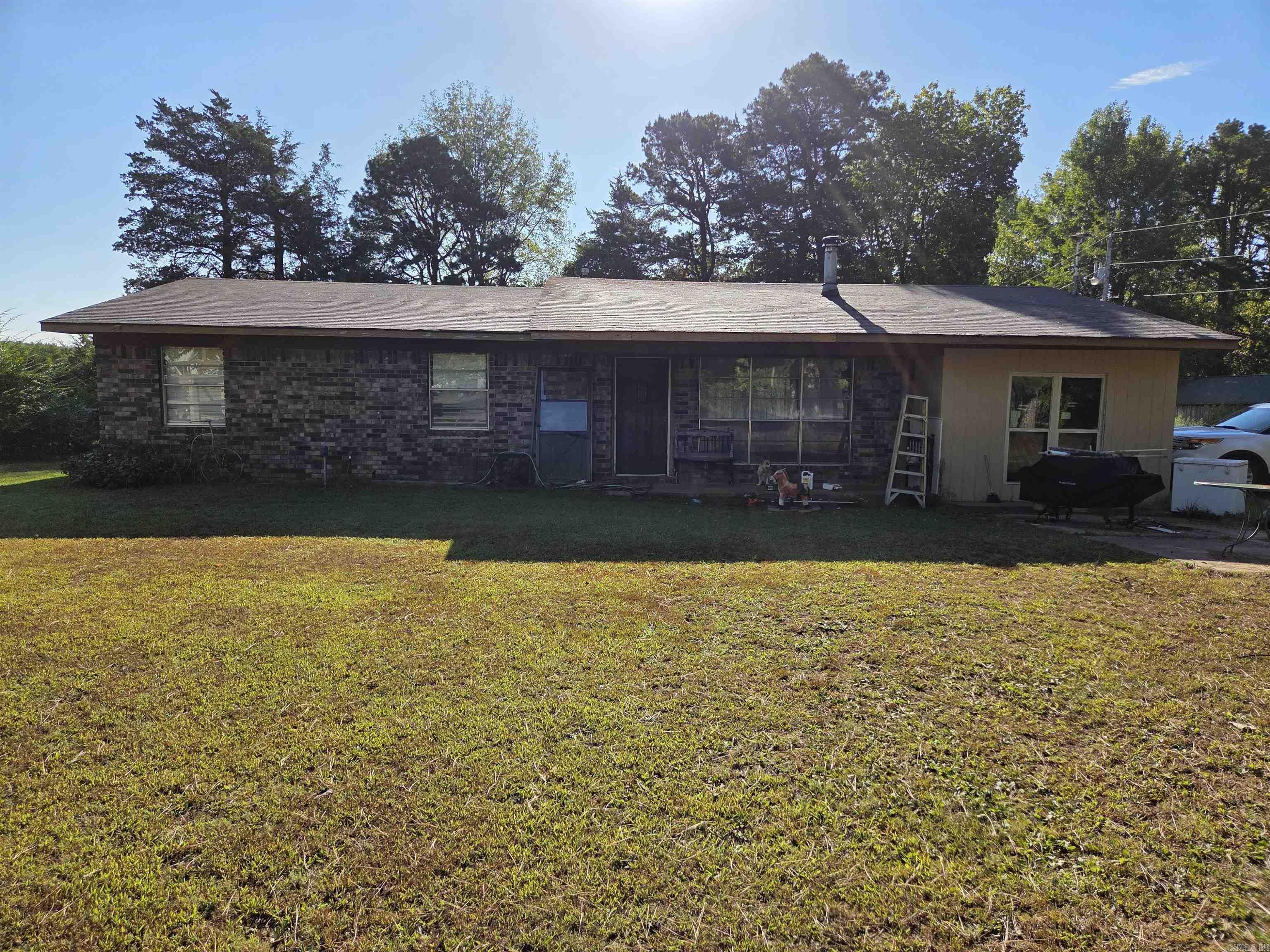 Welcome to this charming brick home on a quiet private road in Ozone, offering the perfect mix of comfort and value. With 1,788 square feet of living space, this single-level home features a thoughtful addition and a converted carport bonus room, giving you plenty of room to spread out. The layout includes 3 bedrooms, 2 baths, and cozy living areas that are move-in ready. The property sits on 0.76 acres with beautiful landscaping, a fenced backyard for privacy, and a storage building for all your tools and hobbies. The covered porches are inviting spaces for relaxing outdoors. Updates include a 2018 electric water heater and a roof that’s only 10 years old. The home also offers a wood-burning option, propane tank (owned and conveys), and plenty of character throughout. With its size, updates, and curb appeal, this home is an incredible value that won’t last long!