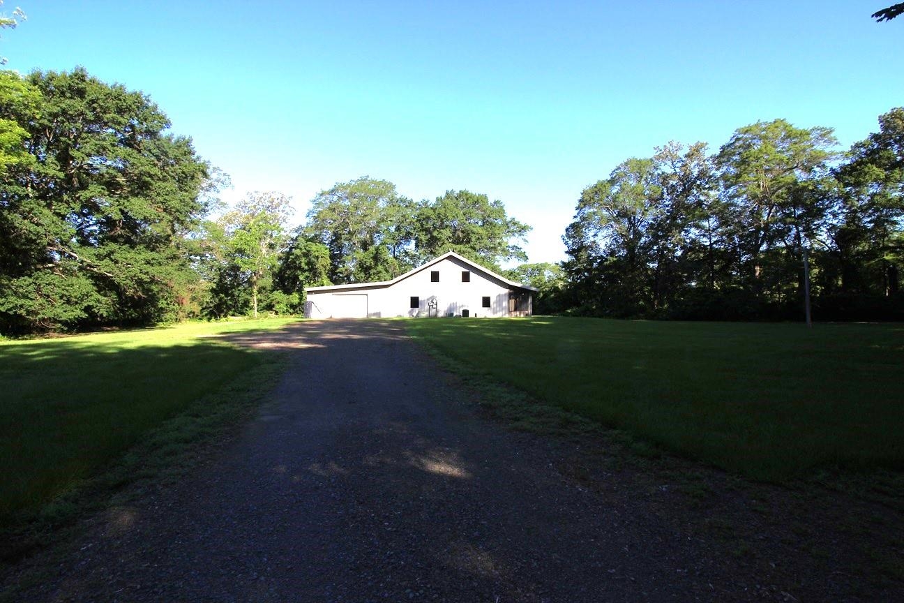 5.16 Acres on Cache Bayou in Cache Bayou Estates, with a barndominum. 1600 SF with attached 2 car garage. City water, gravel launching ramp into bayou. Excellent fishing and duck hunting. Extremely close to Black Swamp WMA, Cache River & White River