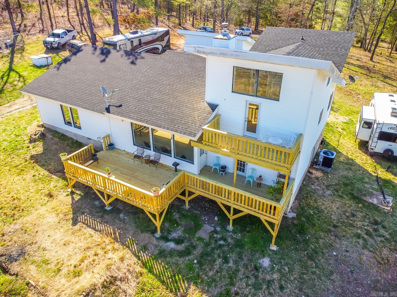 SELLER NOW OFFERING $5,000 TOWARD BUYER'S CLOSING COSTS! Welcome to the market 1051 Toadpole Lane! This 3 bed, 2 bath home with bonus sunroom/office and 2548 sq ft has it all! Private 18-acre retreat in the heart of nature and a modernized home with top-notch amenities! As you enter the home you immediately notice the nice, open layout. Large windows in the living area frame stunning views of rolling hills and pastures. A creek borders the property on one side. You can ride horses in the pasture, or observe deer, turkey, and quail in their natural habitat. Great places for goats, cattle, horses and chickens. The wood burning fireplace warmly invites you to get comfortable and prop up your feet. A newly built 12' x 22' deck is right outside the back door. Two of the bedrooms have walk out decks. Recent upgrades include new water heater, energy-efficient insulation, new 5-ton heat pump, UV light air filtration system system, fresh ductwork, new light fixtures, butcher block island, and stainless steel appliances. Has a working well (not in use) and a 50 amp RV hookup. The septic tank has been newly serviced and pumped. Private pond for fishing. Call today to schedule a tour!