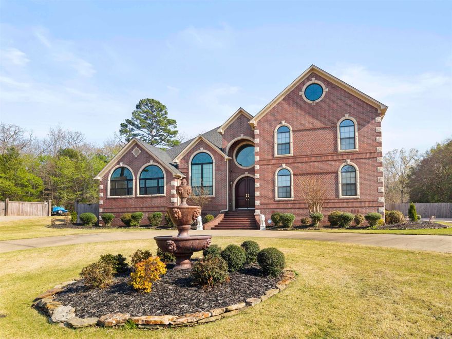 Custom-built home by Bobby Wooten offering approximately 4,695 sq ft of living space.This home features 6 bedrooms  and 4.5 bathrooms. The living room features a 23-foot vaulted ceiling, skylights, gas log fireplace, and built-in cabinetry. The kitchen, living, and dining areas are connected with an open design and include a new stove and microwave. The owner’s suite includes a walk-in closet, built-in storage, jacuzzi tub, and walk-in shower. A guest suite features a vaulted ceiling and jacuzzi tub. Upstairs includes a large game room and third-floor loft, providing additional space for a variety of uses. Exterior features include a 16x24 in-ground pool with a Hayward automatic cleaning system, and a 10x10 pool house with bathroom and outdoor shower.
