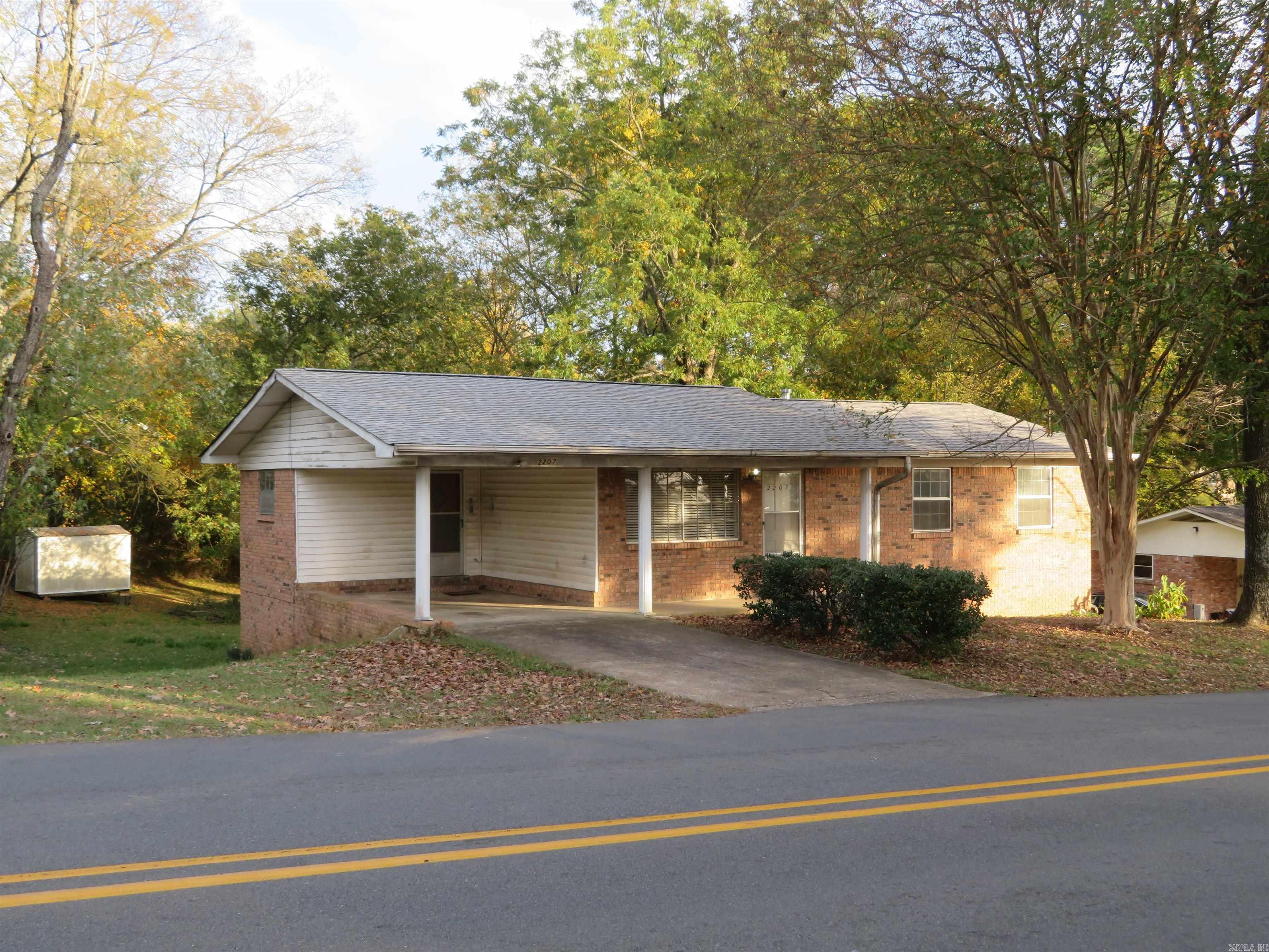 Subject Property is a TWO-LEVEL Residence. The Main-Level measures approx. 1,251 SQ. FT., heated/cooled. The Lower-Level ('walk-out' Basement Level) measures approx. 684 SQ. FT., heated/cooled. The Main-Level FLOOR PLAN/ROOM ARRANGEMENT consists of the LIVING ROOM with front entry door, a KITCHEN/DINING COMBINATION with exterior carport door, a separate LAUNDRY ROOM, a HALL BATHROOM (full), a HALF BATH, THREE BEDROOMS, and a HALLWAY with door to STAIRWAY leading to 'walk-out' Basement Level. The Lower-Level has a large FAMILY ROOM/GAMEROOM with WET BAR area, a FOURTH BEDROOM, a BATHROOM with older, 'metal' shower stall and wide vanity --- PLUS a SINGLE GARAGE/WORKSHOP room with CH/A unit, hot water tank, and an older 'lift-up' garage door (manually operated) and a BONUS ROOM with a clothes closet/storage closet and the electrical Breaker Box/Fuse Box. The large Family Room/Game Room combination features a SLIDING GLASS DOOR that accesses an exterior, concrete patio --- and the back yard area. This Residence has seen few updates/improvements over the years. It is truly 'dated'. The single wall oven and the separate cook-top/surface unit (in the kitchen) do not function.