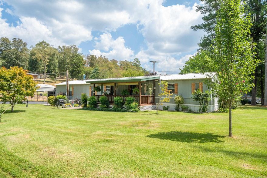 Incredible Value Alert! Welcome to your dream retreat! This charming 3 bedroom, 2 bathroom mobile home is the epitome of affordable luxury. Nestled on a sprawling 1.06 acre corner lot, you'll have all the space you've ever dreamed of. Love the water? You're in luck! This gem is a stone's throw away from the tranquil lake. Enjoy neighborhood only, private lake access and boat launch. Step inside to discover a super clean home that's been lovingly maintained. The kitchen boasts white cabinets infusing the space with a fresh vibe. The refrigerator is included – a great bonus! Natural light pours in, highlighting the immaculate condition throughout. Indulge in the luxurious master bathroom, featuring a newly installed shower and convenient double sinks. It's your personal oasis for relaxation. Feel secure with the included storm shelter – a reassuring feature for any weather event. With camper storage, a large two-car garage with a shop area, and a storage shed, you'll have room for all your toys and tools. All of this can be yours for just $119,000! It's an opportunity that won't last long. Don't miss out on this amazing deal that combines comfort, style, and affordability.