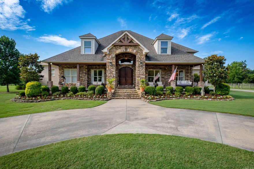 Stunning Western Pulaski County Country Estate on ten acres just across from the Rattlesnake Ridge Nature Area with amazing views of Pinnacle Mountain.  This updated home boasts an open floor plan that is perfect for entertaining. Warm and inviting interiors with abundant living spaces offer something for every member of your family including a formal dining room and office. The gorgeous primary suite is on main level with a sitting area looking out over the beautiful property. The great room with fireplace opens to gourmet kitchen featuring a large island, wine refrigerator, double ovens, gas range and a lovely breakfast room. The formal dining room is perfect for any large family gathering. Upstairs offers a game room with fireplace, four large bedrooms, two full bathrooms and a landing that is perfect for a reading room or your favorite hobby. Outdoors enjoy two covered porches, level acreage, Nowlin Creek, 3 stall barn with tack room & two pastures designated by 4 rail wood fencing. Three car side load garage, generator, city water and buried propane tank. Flood insurance required. See Agent Remarks for more info!