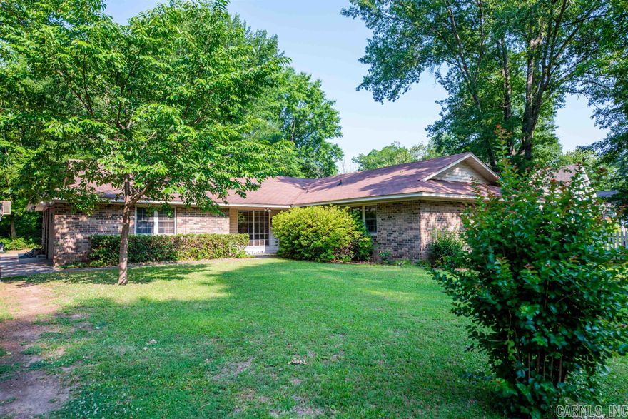 Welcome to this charming single-family home that offers endless potential in the desirable Conway downtown neighborhood. With its convenient location and inviting features, this home is sure to capture your heart. The main living areas are adorned with tile and carpet flooring, creating a cozy atmosphere that invites you to relax and unwind. The home offers three bedrooms and two bathrooms. The dedicated office space, extra large laundry/craft room and added built-ins in the living room add to the versatility of the home. The kitchen serves as the heart of the home, offering the perfect space to unleash your culinary creativity. Step outside and discover the exterior features that enhance the overall appeal of this property. The brick  exterior, covered breezeway, concrete patio, extended driveway, outdoor storage with a sink and shop with electricity are all features to note. The lot spans 7,800 square feet, offering a manageable size that is perfect for those seeking a low-maintenance lifestyle. (agents see remarks)