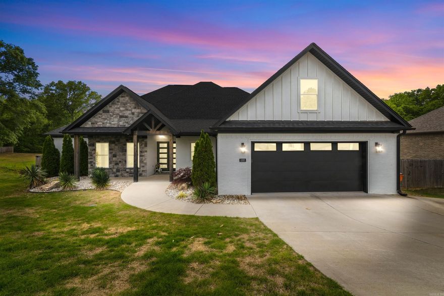 Step into refined living with this beautifully designed home set on 1.21 acres, where luxury meets functionality. Flooded with natural light, the open-concept layout features wood-look tile in the main living areas, wet spaces, and primary suite, anchored by a stunning living room with soaring vaulted ceilings. The gourmet kitchen is a true centerpiece, showcasing an impressive 11-ft custom island with built-in storage, soft-close cabinetry and drawers, plus dedicated spice and utensil storage, perfect for both entertaining and everyday living. Just off the main space, a dedicated office offers privacy and versatility. Retreat to the primary suite, complete with a spa-inspired bathroom featuring a luxurious pass-through shower, a striking stone wall behind the soaking tub, and a custom closet with built-in dressers and vanity. Guest bedrooms each offer walk-in closets for added comfort. Additional highlights include an oversized garage with dual storage closets, a spacious laundry and mud room, and abundant storage throughout. Enjoy peaceful outdoor living on the large vaulted back porch with a fireplace, overlooking gorgeous green space and direct creek access.  See Remarks!