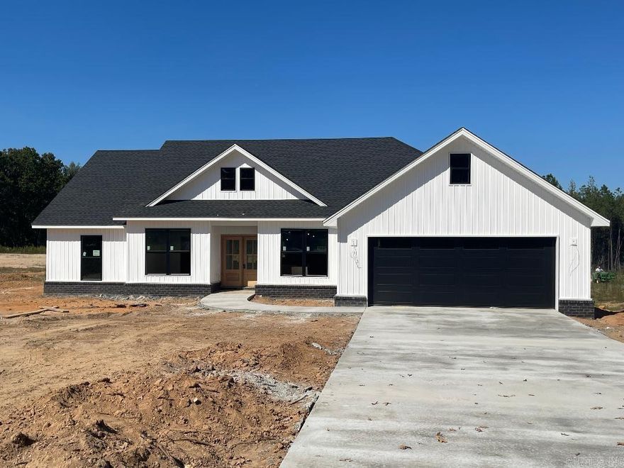 Beautiful new construction home on one acre lot in Wright Place Subdivision. Bryant School District. Features wood burning fireplace in living area with built-in cabinets on each side, bonus room that would be great for office or formal dining room. Master bathroom has separate tile shower and tub, double vanities and huge walk-in closet. Covered back porch. Qualifies for 100% rural development financing.