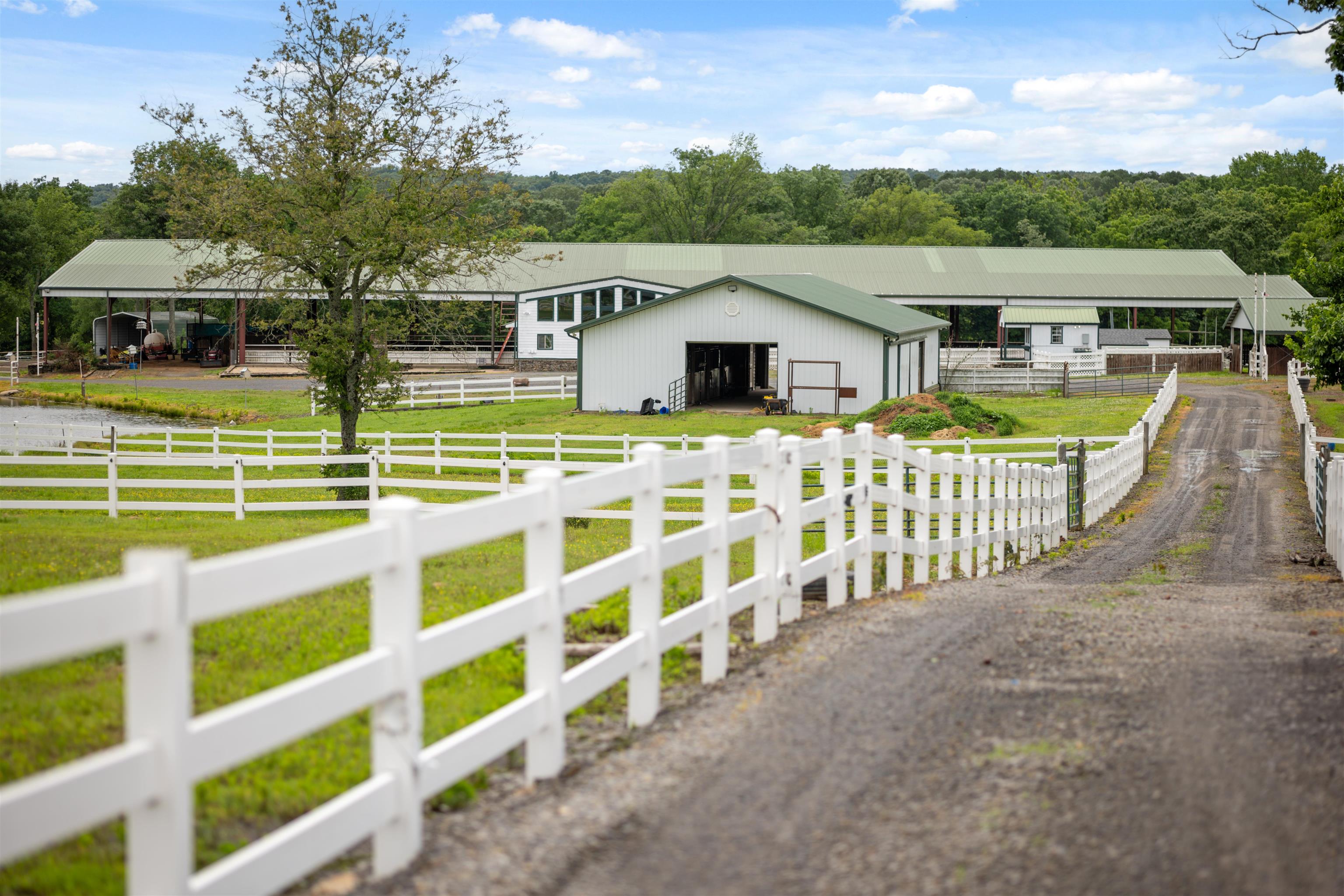 Horse Loverās Paradise at Happy Ranch ā Bee Branch, AR Fall in love with the equestrian amenities at Happy Ranch. Thoughtfully designed with both rider and horse in mind, this property is move-in ready for you and your herd. Built for ease, efficiency, and comfort. Facilities Include: *Spacious Barn with multiple stalls, large tack room, feed storage, and wash bay with hot & cold water. *Cross-fenced pastures with gates for rotational grazing and easy herd management. *Large riding arena perfect for training, lessons, events, or clinics. *Loafing sheds in each of the 5 large turnouts. *Apartment attached to covered arena with downstairs bedroom, bathroom, kitchen, & living area. Loft upstairs can be used as announcers area for events or a second bedroom area. *16 RV hookups, perfect for hosting events. *Separate concession building with kitchen & public restrooms. This ranch is built for comfort, function, and horse-first careāready for boarding, breeding, training, or simply living out your equine dreams in style.
