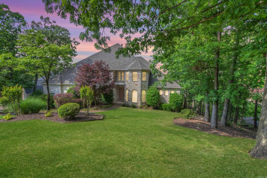 Indulge in luxurious waterfront living at this stunning Driftwood Estates residence. With 7260 square feet of living space across three levels, this home features 6 bedrooms, 4.5 baths, and a 3-car side-loading garage.  Enjoy breathtaking views of Lake Hamilton from every angle of the house. Recent modern updates include new luxury vinyl plank flooring, creamy walls, and quartz counters. Two gas fireplaces provide cozy ambiance.  Outside, relax in the pool with a hot tub waterfall, surrounded by beautiful landscaping. A single stall boat dock with lift awaits your water adventures.  Additional features include a whole house generator backup, lake-fed sprinkler system, and four zoned HVAC units. Perfect for entertaining, the lower level offers a kitchen, living room, and walk-out access to the pool and boat dock.  Experience elegant waterfront living in this meticulously designed home.
