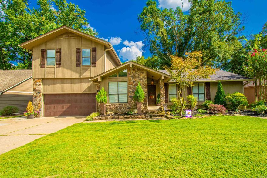 This Beautiful Home is a Must See!! Sitting on  5 mile creek with a gorgeous view of the woods and creek while you are sipping your morning coffee. This Remodeled Home has an open floor plan! A Rock Island is a focal point of this open plan as well as the Rock Fireplace. 3 Bedrooms which includes the Master on the Main level makes this Home even more Appealing! You also have an office or dining area on this level. Upstairs enjoy 2 more bedrooms plus a bonus room or craft room and a full bath with double Sinks. New Oven 2023, new master shower 2024. Come by and take a Look Today! Agents see remarks