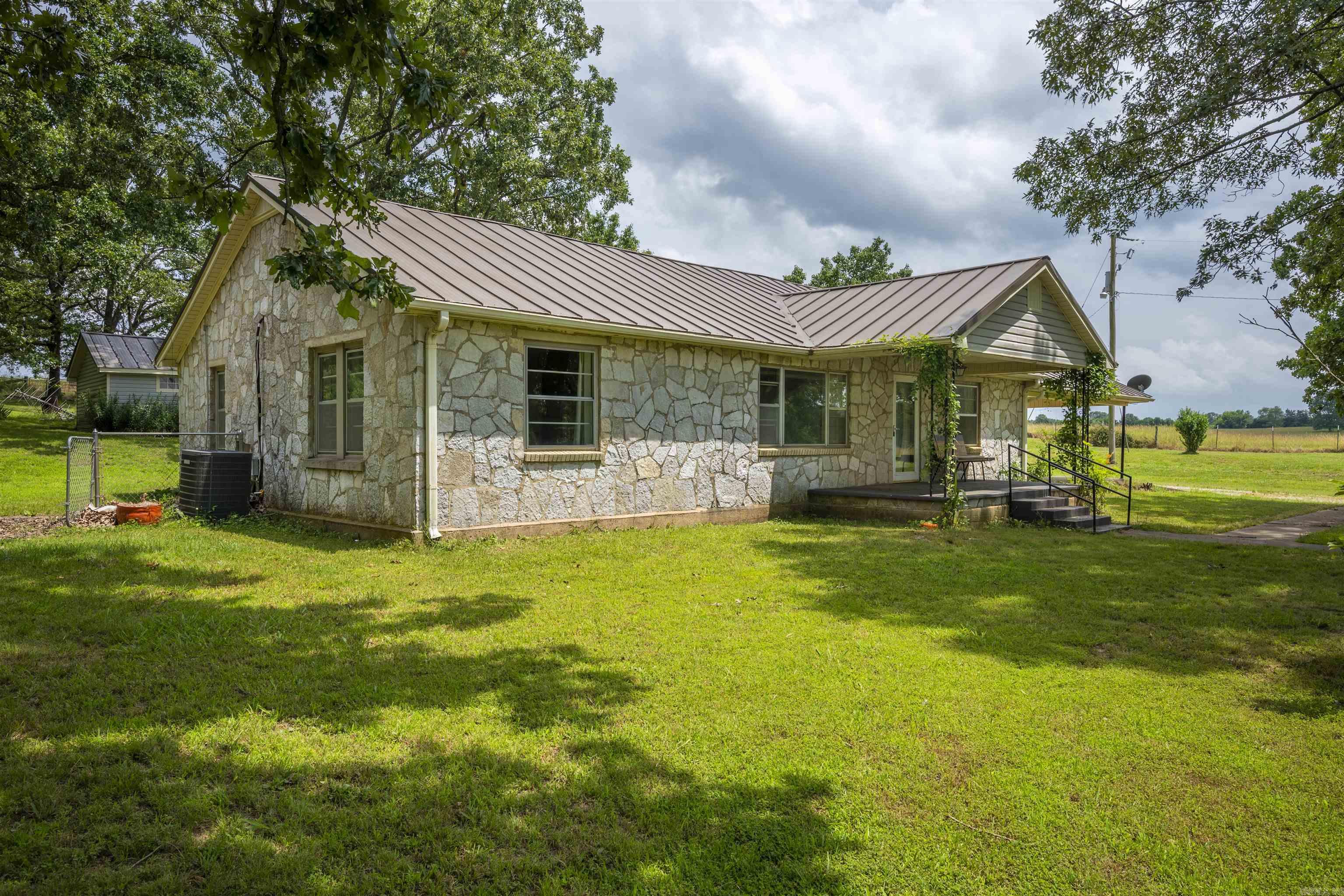 Discover peaceful country living at 250 Shamrock Ln in Sulphur Rock. This charming 3-bedroom, 1.5-bath home offers a beautifully remodeled kitchen and full bathroom with updated appliances, giving you a move-in ready feel with modern finishes. Enjoy the spacious, fully fenced backyard complete with a concrete patio, a storage shed, and your own water wellāideal for outdoor living and gardening. A built-in storm shelter adds extra security and peace of mind. Located on a quiet road just minutes from Batesville, this property provides the perfect balance of privacy and convenience. Experience the charm of rural Arkansas with all the essential updates.
