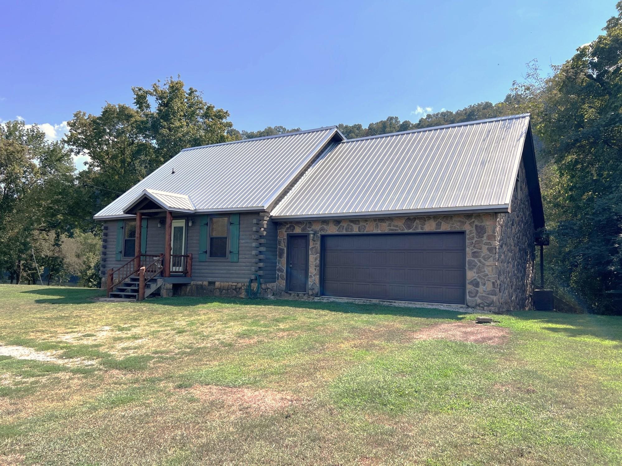White River Retreat with Flexible Guest Studio Experience Ozark living just steps from the White River and Sylamore Creek. The main home offers 3 bedrooms and 2.5 baths, with the primary suite and guest bath on the main level, and two bedrooms (including a loft) plus a full bath upstairs. Tucked beside the garage, the property includes a 1BR/1BA studio apartment—ideal for guests, extended family, or rental income. Designed with privacy in mind, the studio has its own entrance and divided back porch, yet also connects to the main home through an interior doorway if desired. Surrounded by mountain and bluff views, this property is located just 4 miles from downtown Mountain View, 5 miles from Blanchard Springs Caverns, and a short drive to the Buffalo River. Whether you envision a full-time residence, vacation home, or income opportunity, this retreat offers flexibility, comfort, and the beauty of the Ozarks all in one.