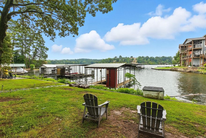 Don't miss out on this 2 for 1 opportunity! Enjoy the serenity of your waterfront retreat while earning passive income!  The cozy cottage offers a 2 bedroom and 1 bath. The back patio has a great hot tub that will convey, the patio leads down to the private boat dock with a brand new lift! It boast nearly an acre of land and 100 feet of lake front access with amazing views.  The loft is entirely separate. It was added in 2000. Could be used as a second rental or mother-n-law quarters. It will be yours to decide. It has 2 bedrooms, 2 bathrooms, and a cozy family space. The upper deck, has an amazing view of Lake Hamilton, and below is a covered patio with a relaxing hot tub to convey!  Don't miss this opportunity. This Lake Front Resort is being sold fully FURNISHED!