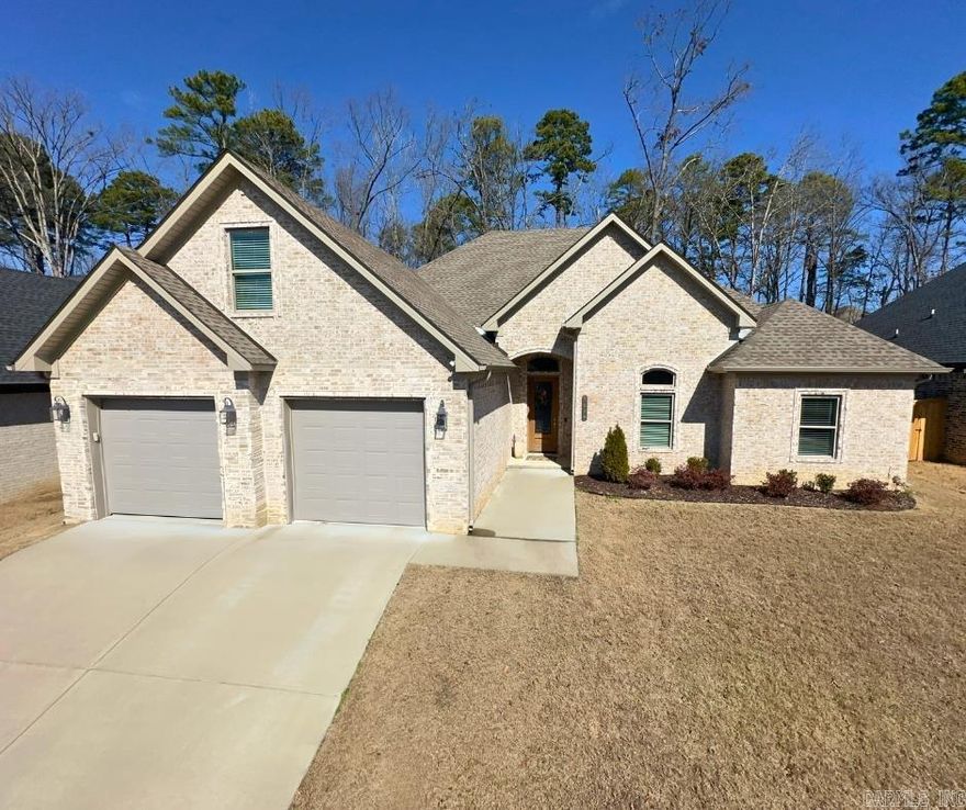 Welcome to the gated Hurricane Gardens Subdivision! This 2022-constructed home is ready for you to make it your own. Upon entering through the front door, you’ll be greeted by a massive open-concept living room that seamlessly flows into the kitchen and dining space. The living room features a stunning brick fireplace and windows that offer serene views of nature.  The chef’s kitchen is a true centerpiece, boasting not one but two granite islands, a gas range, a wall oven, and a spacious pantry. The primary suite offers ample space and lofty ceilings, while the primary bathroom features a fully tiled shower, a luxurious soaker tub, and an expansive walk-in closet.  On the opposite side of the home, you’ll find three additional bedrooms and a shared bathroom. Upstairs, a large bonus room awaits, conveniently situated above the garage.  Step into the backyard, and you’ll discover an outdoor kitchen complete with a built-in grill and sink, all set under a beautifully covered porch with plenty of space for relaxation or entertaining.  Don’t miss this unique home, just minutes away from restaurants, shopping, groceries, and more. Come check it out today!