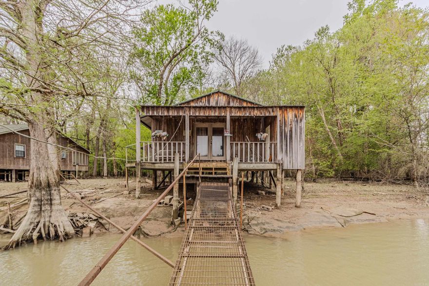 DUCK HUNTERS!! This fully furnished 24x30 cabin sits on a 100x100 lot with a 2 stall boat dock located in Brookings! Accessible by river this property is not a sitting duck! Better act fast!