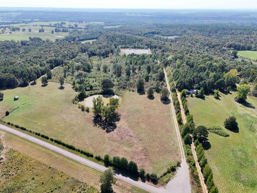 14.2 acres for you to build your dream home, hunt, fish, you name it! Property has been bush-hogged, the front of the property is cleared. Check out the aerial drone footage in the video link. Agents see remarks for more info.