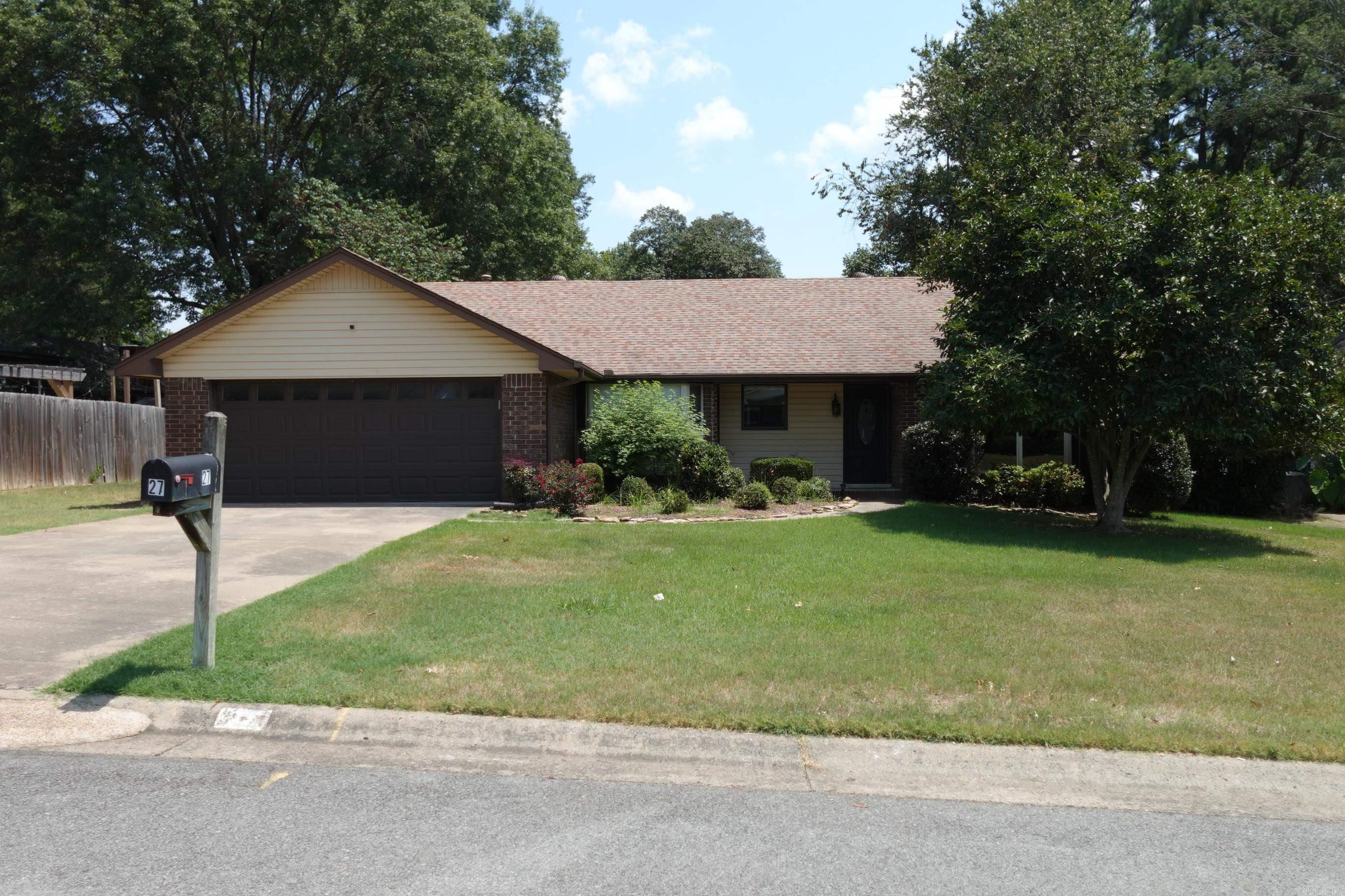 Cute well maintained 3BR/2BA split floor plan home with updates and ready to move in! Just completed updates: all cabinets in entire house painted, Kitchen, Living area, primary BR and BA totally repainted even the ceilings! Most all of the trim and doorways repainted, new door from house to garage, front door repainted with new deadbolt. HVAC has been serviced and cleaned 7/25. Garage door serviced & 2 new openers 7/25. Sprinkler System serviced w/ repairs 7/25. Fireplace has been inspected and cannot be wood burning without repairs but has gas logs present. Updates in 2019: Garbage disposal, faucet in KIT, covered back porch, fence with oversized gate. KIT has SS appliances and comes with SS refrigerator, granite countertops w/backsplash. Both bathrooms have tile showers. No carpet in this home!! Walk-in closets! Roof - 2018. Truly move in ready!! Close to interstate, shopping, Dr's, UCA, Conway Country Club and walking trail! SEE AGENT REMARKS.