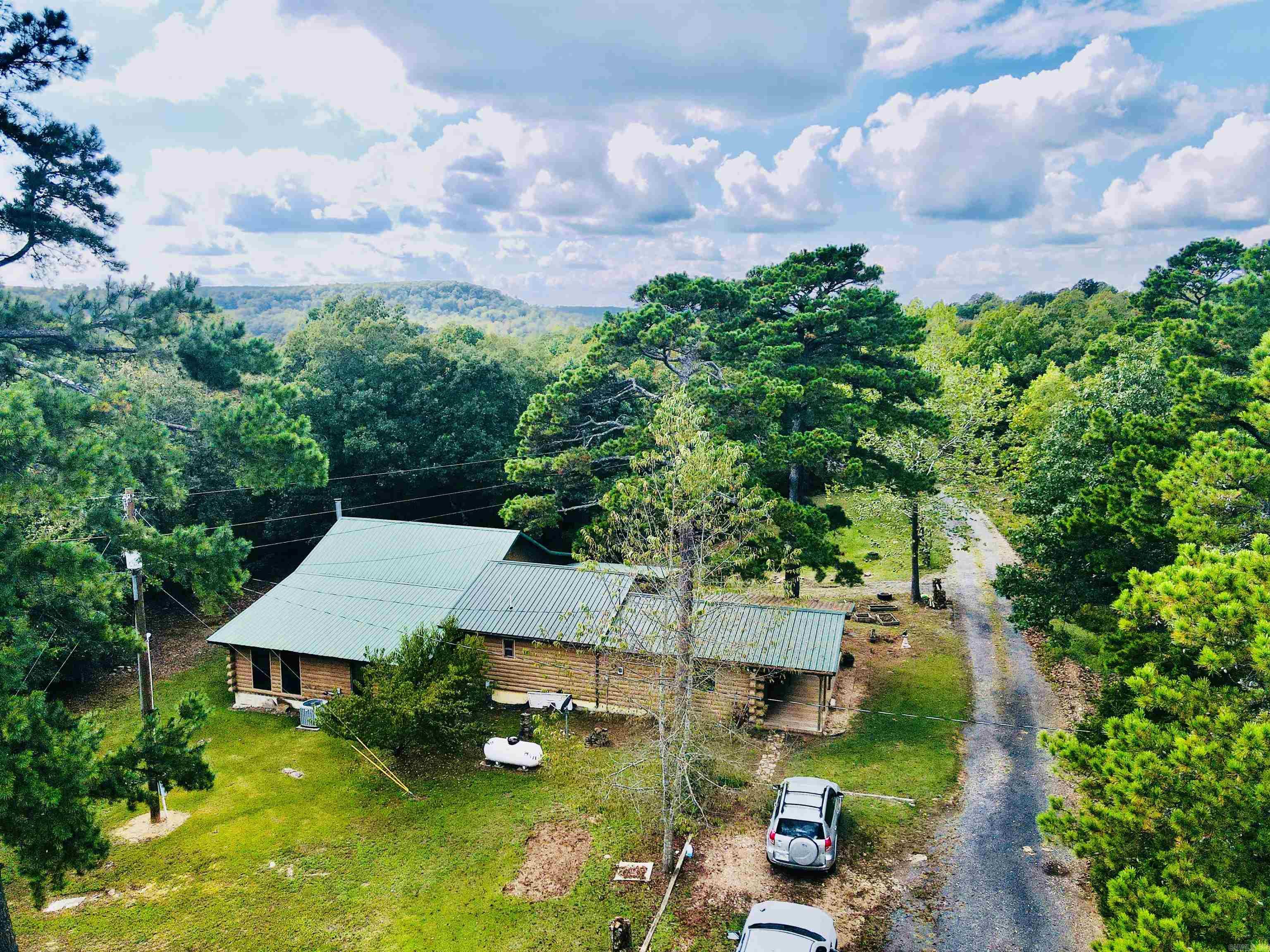 This spacious 2,528 sq. ft. home offers 5 bedrooms, 2 full bathrooms, and a third bathroom that’s nearly complete, making it perfect for a growing family or those who enjoy extra space. Nestled on approximately 13 acres, the property features a peaceful pond, a seasonal creek, a food plot, and abundant wildlife, creating an ideal retreat for nature lovers and outdoor enthusiasts. A 20x20 shop provides plenty of room for storage, hobbies, or projects, adding to the versatility and appeal of this unique country property.